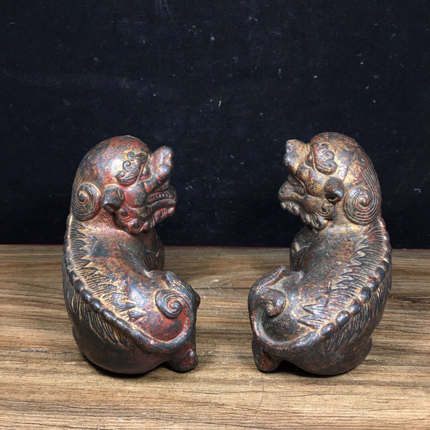 A pair of antique Chinese bronze lions