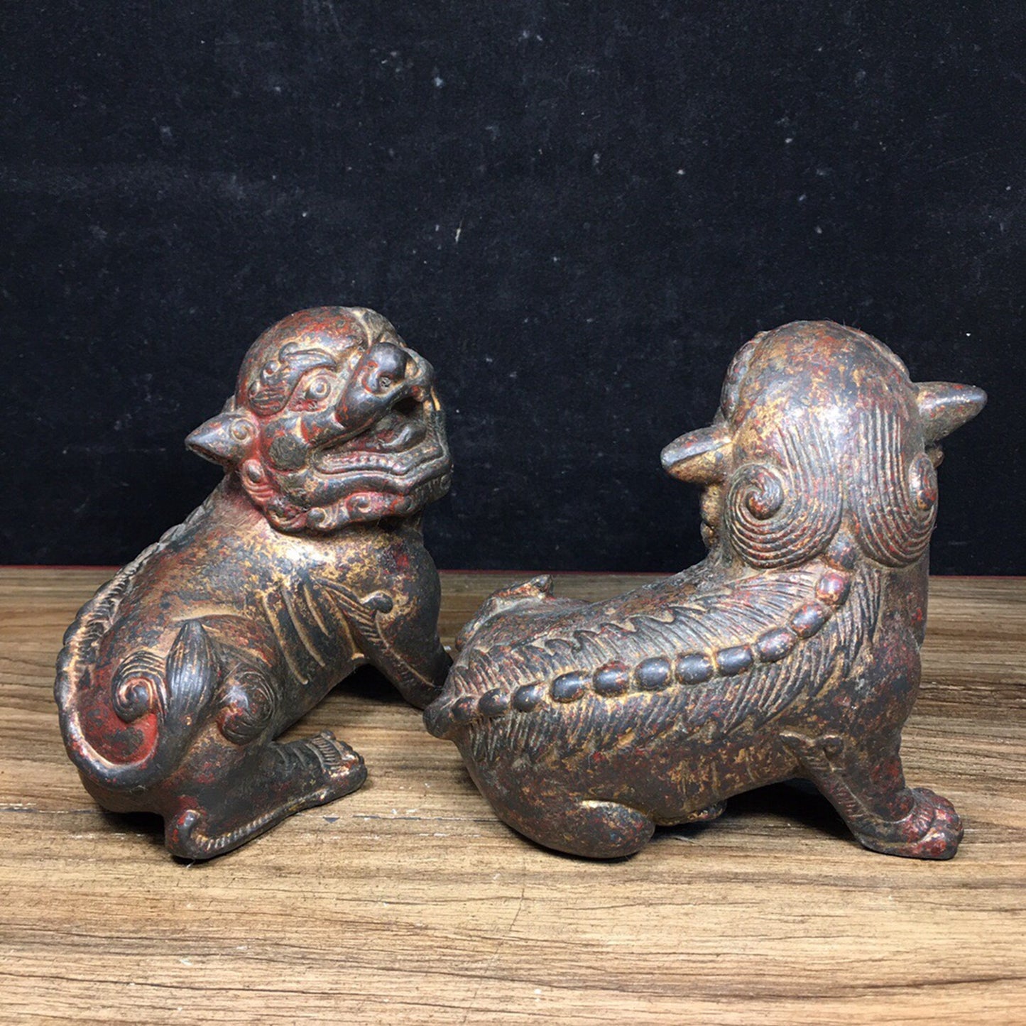 A pair of antique Chinese bronze lions