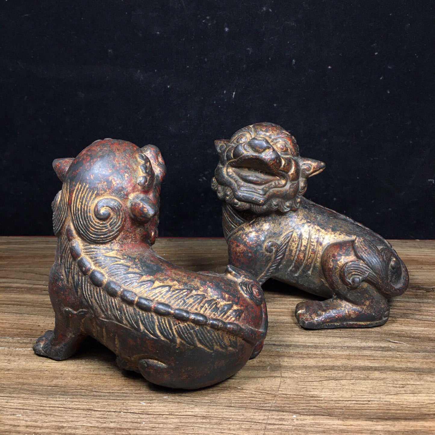 A pair of antique Chinese bronze lions