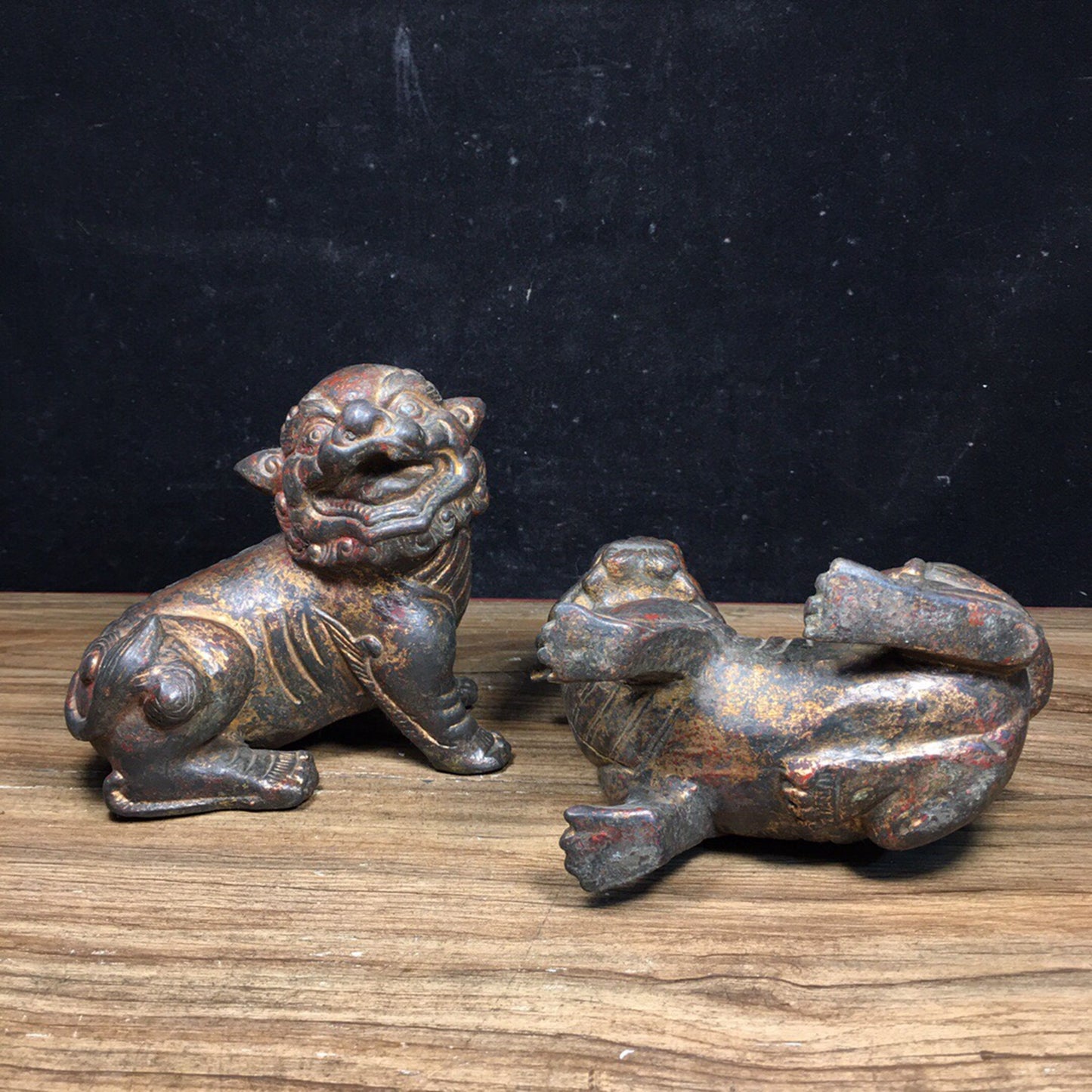 A pair of antique Chinese bronze lions