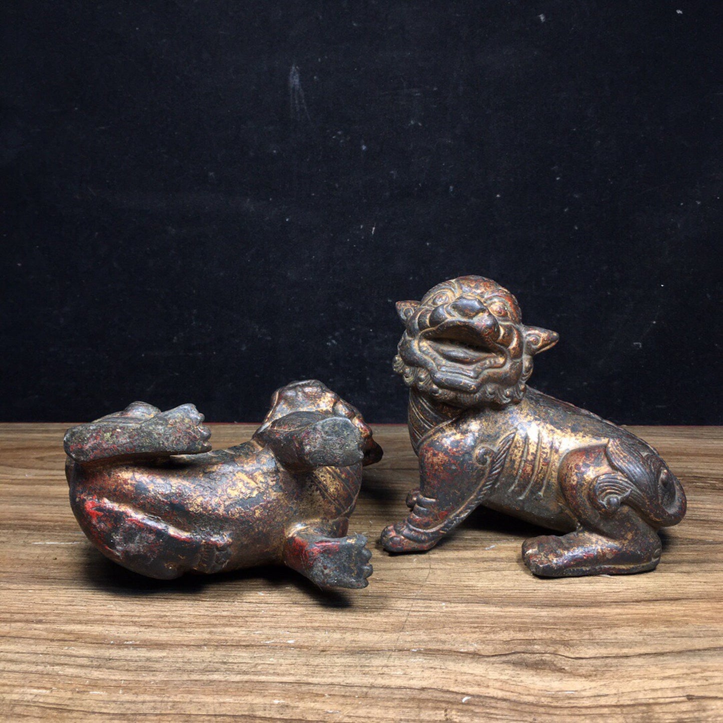 A pair of antique Chinese bronze lions