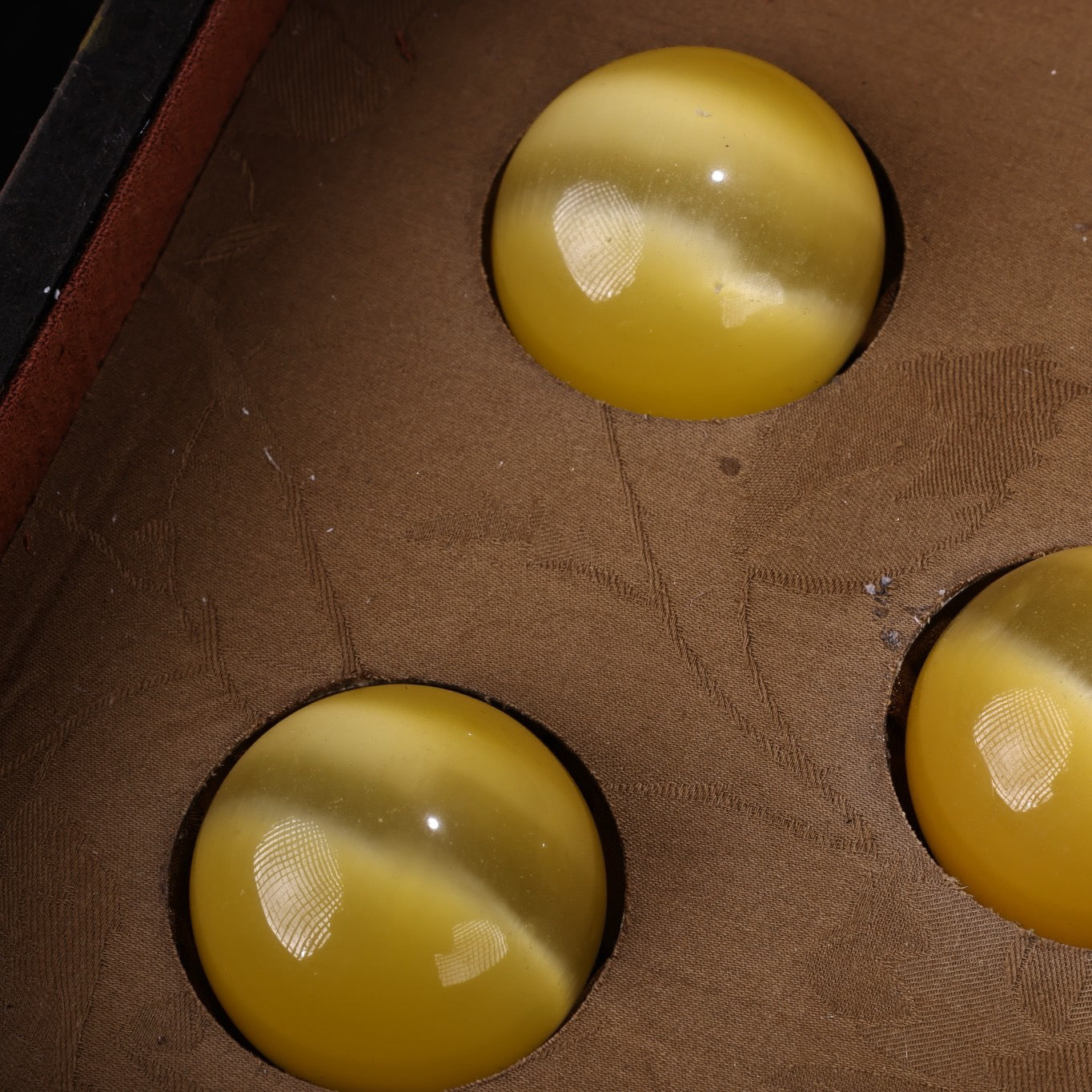 A box of Chinese antique cat's eye balls