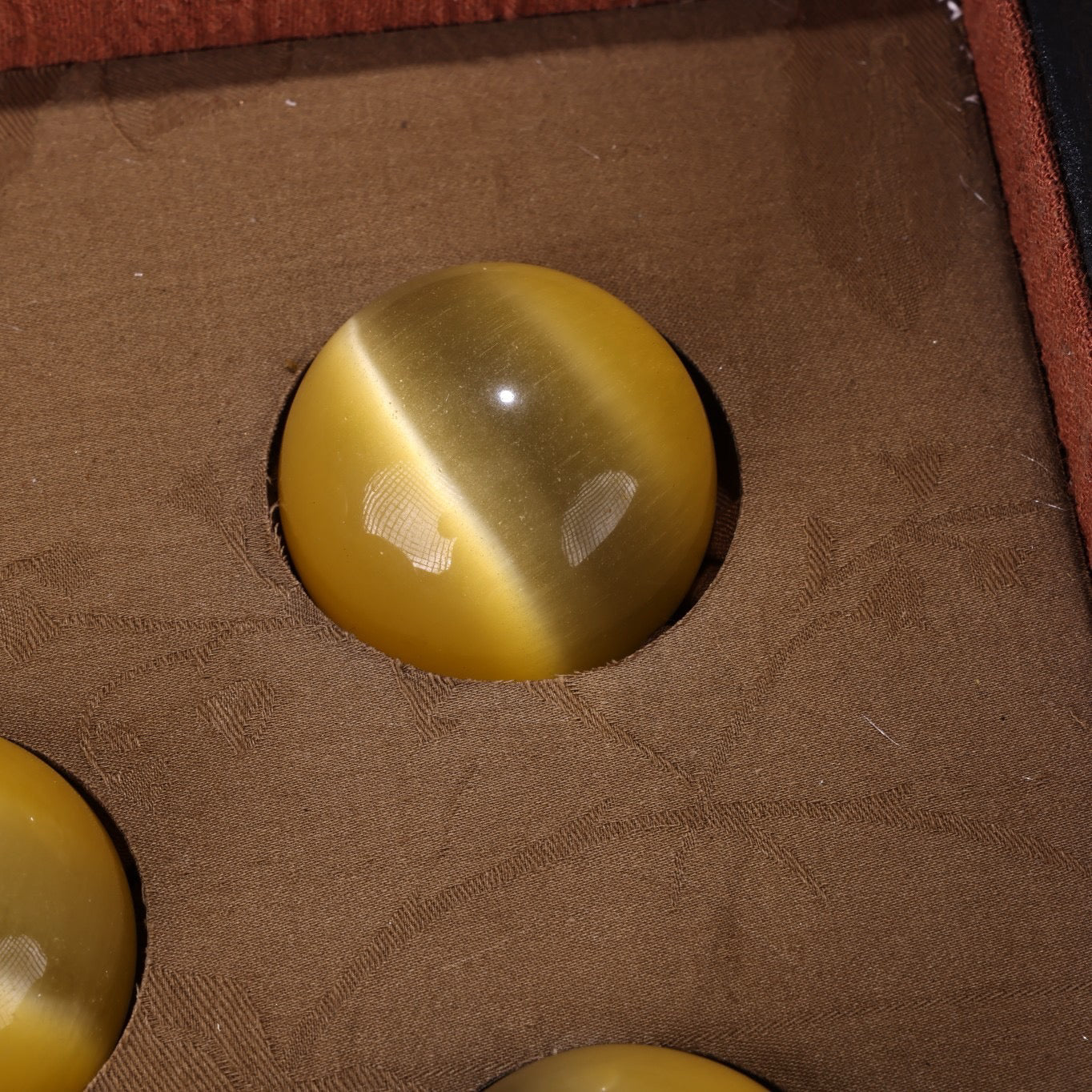 A box of Chinese antique cat's eye balls