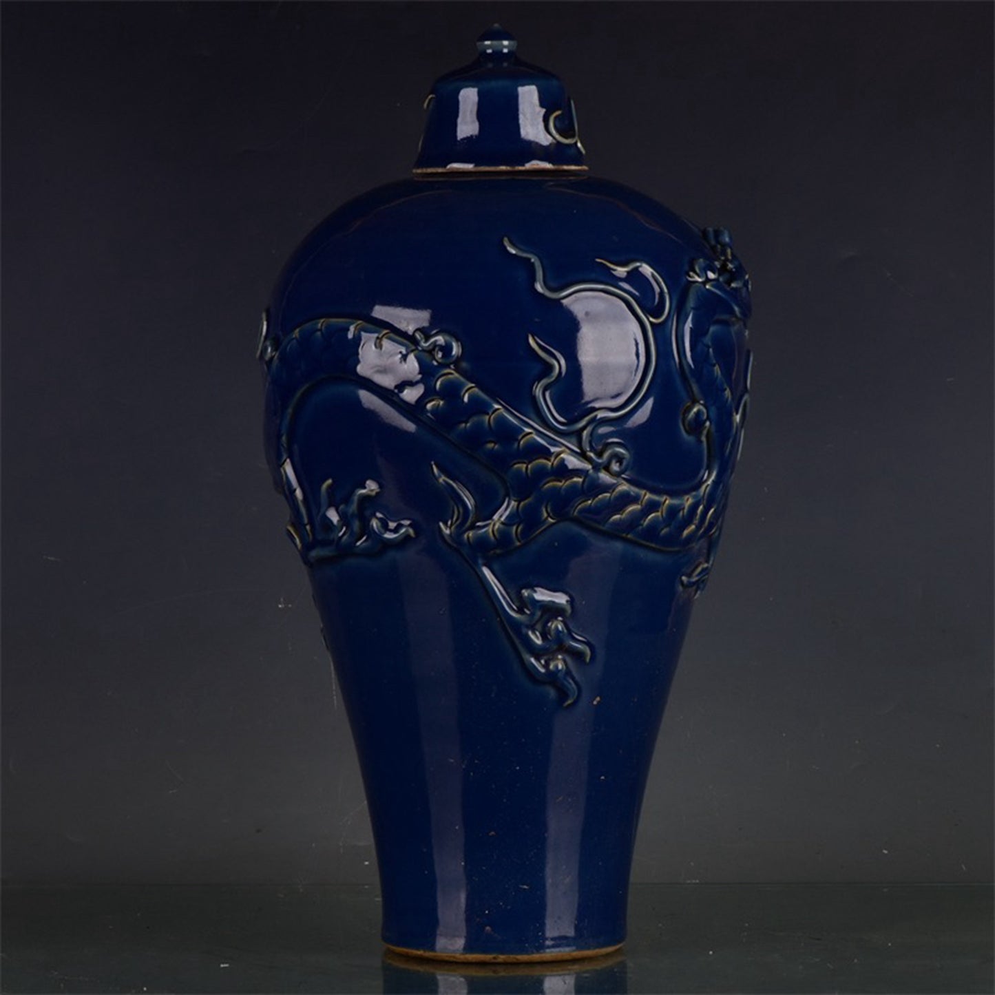 Chinese antique Ji blue relief dragon patterned plum vase