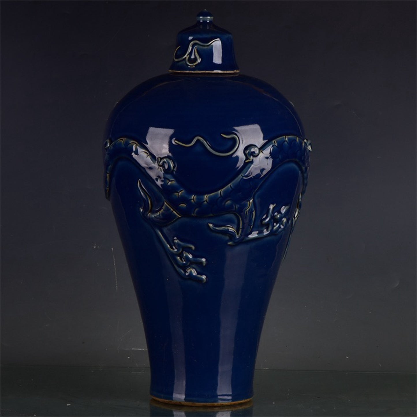 Chinese antique Ji blue relief dragon patterned plum vase