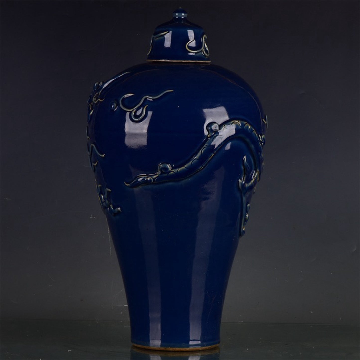 Chinese antique Ji blue relief dragon patterned plum vase
