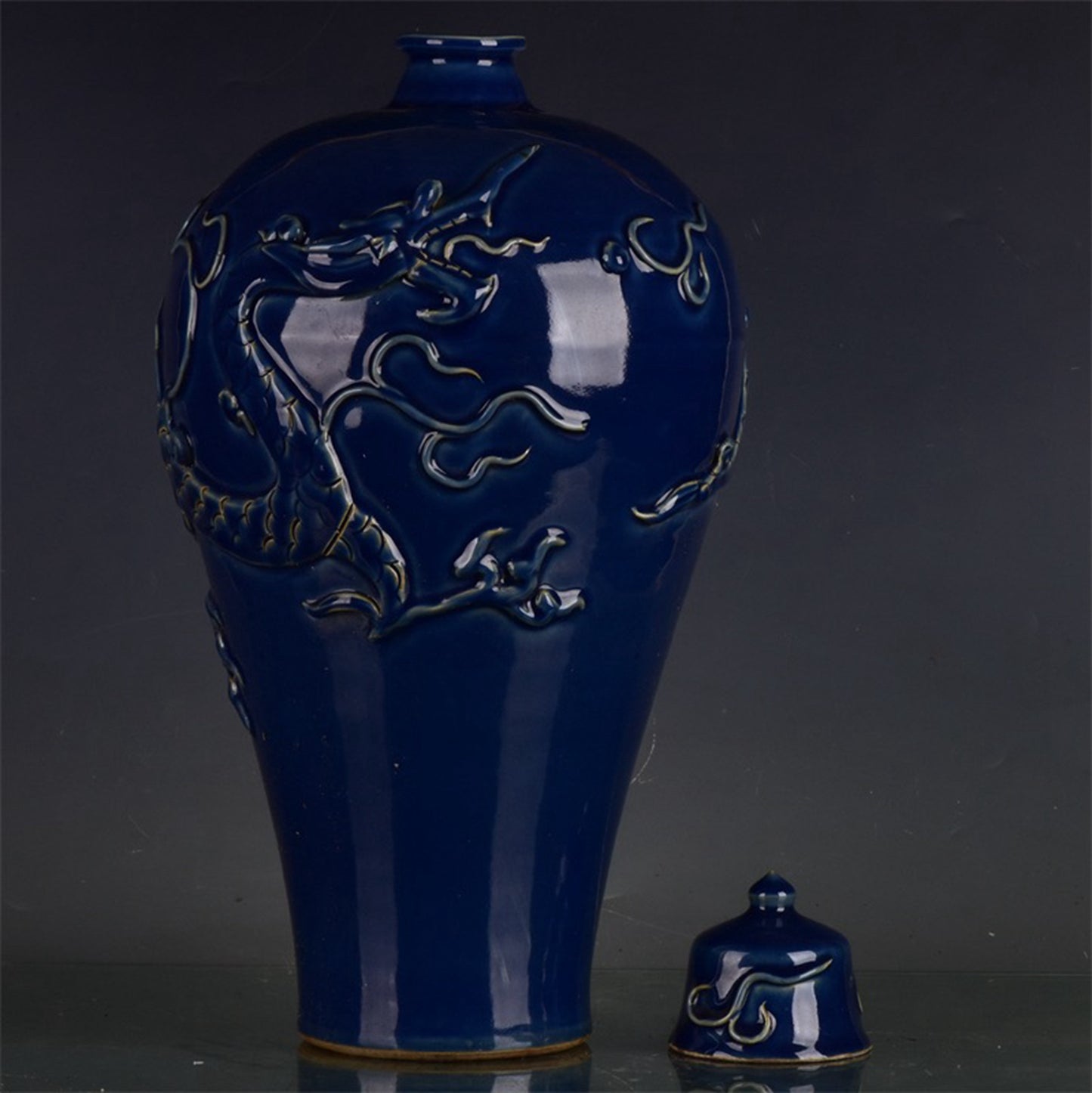 Chinese antique Ji blue relief dragon patterned plum vase