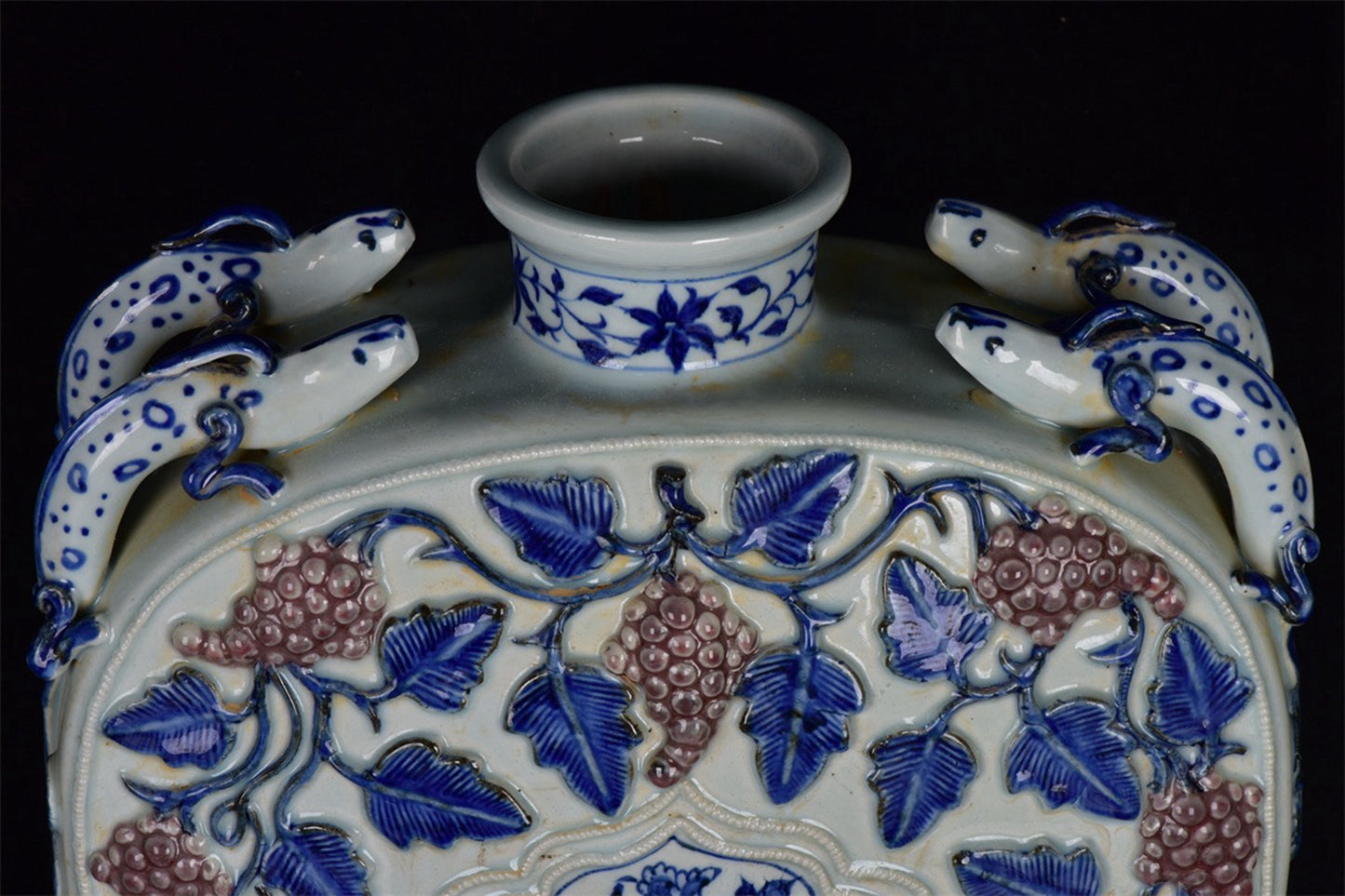 Chinese antique blue and white glazed red relief bottle with multiple grape patterns and a square shape