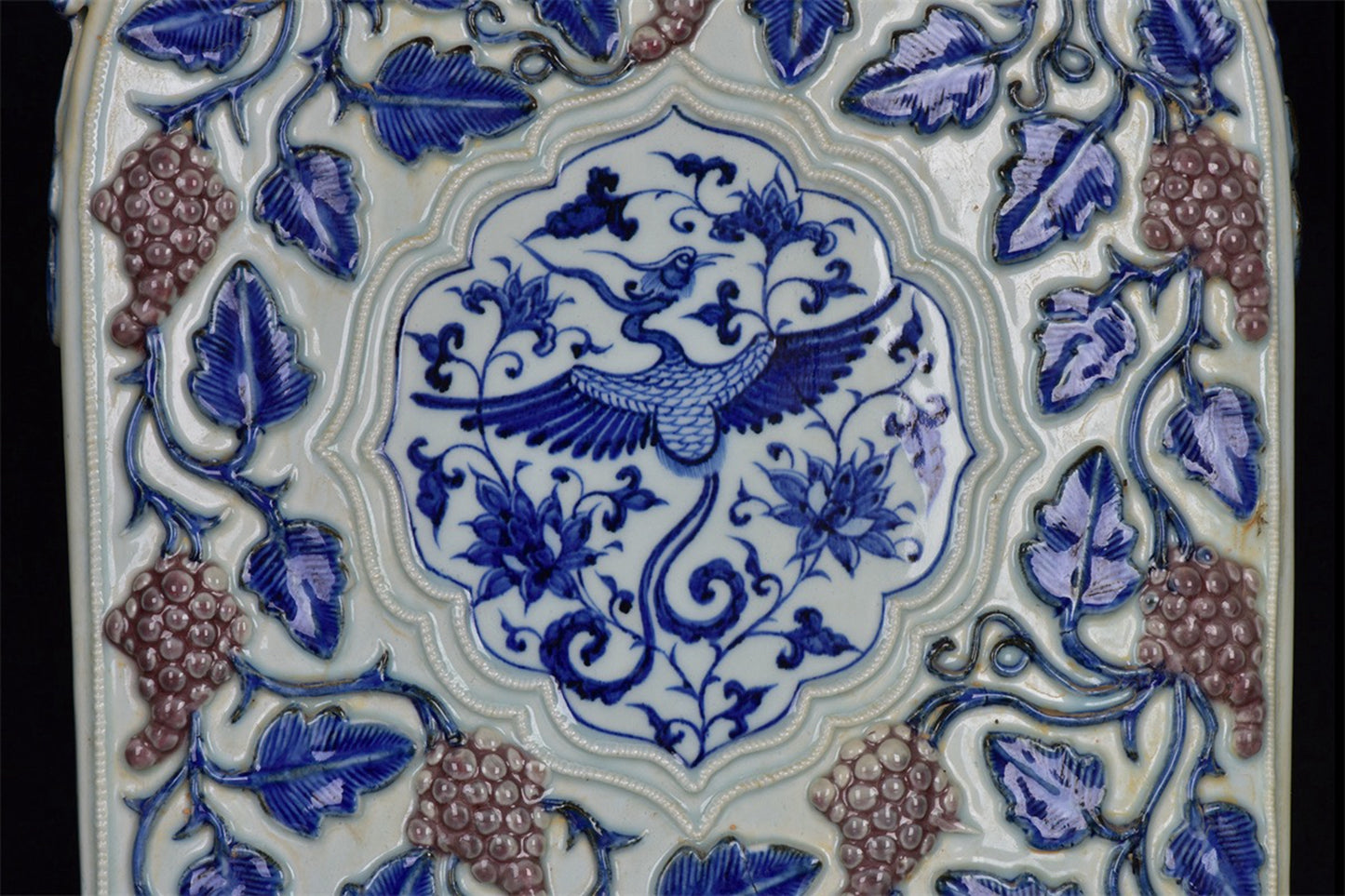 Chinese antique blue and white glazed red relief bottle with multiple grape patterns and a square shape