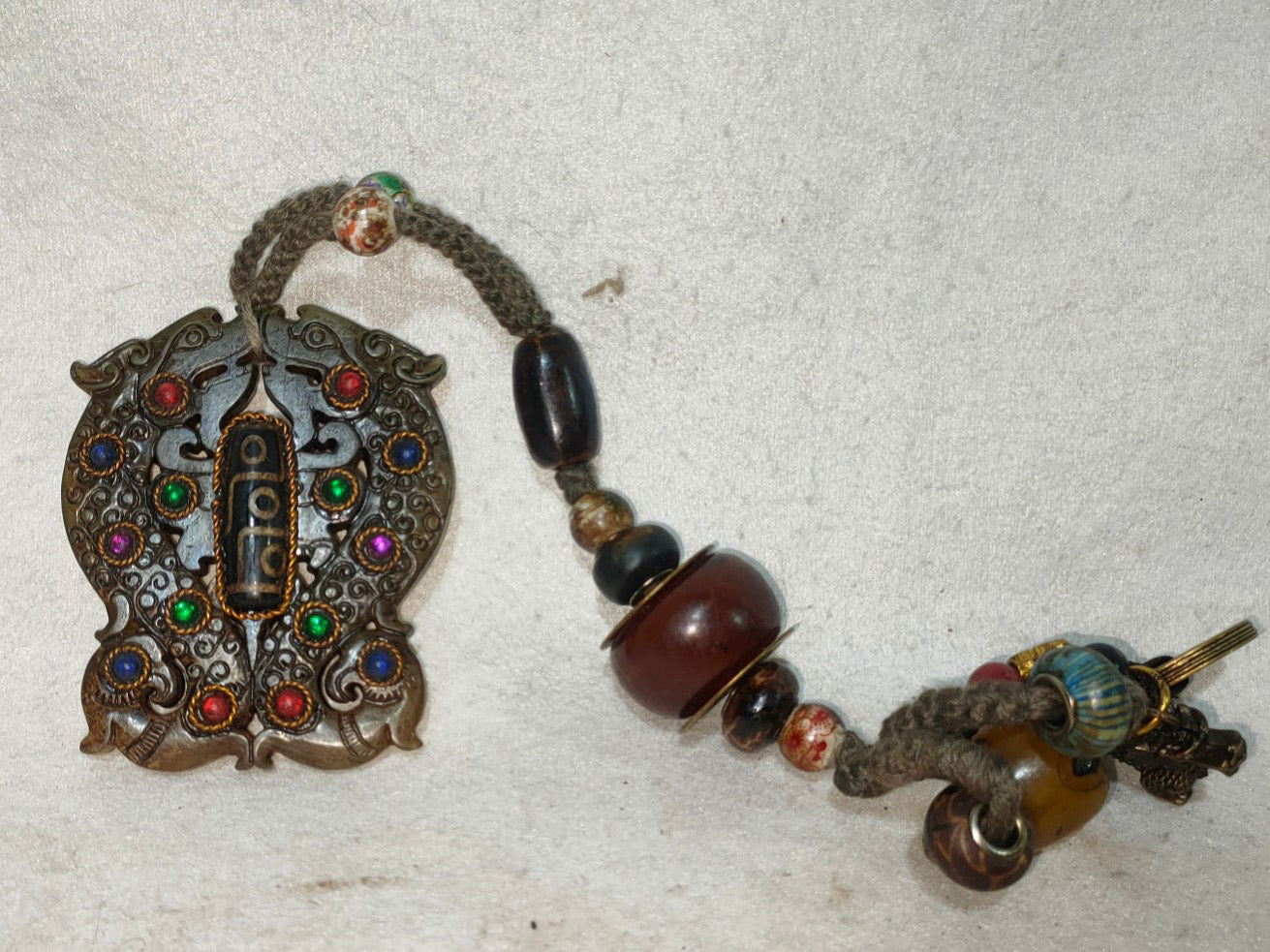 Old jade inlaid with gemstones, heavenly pearls, and turquoise handle pieces