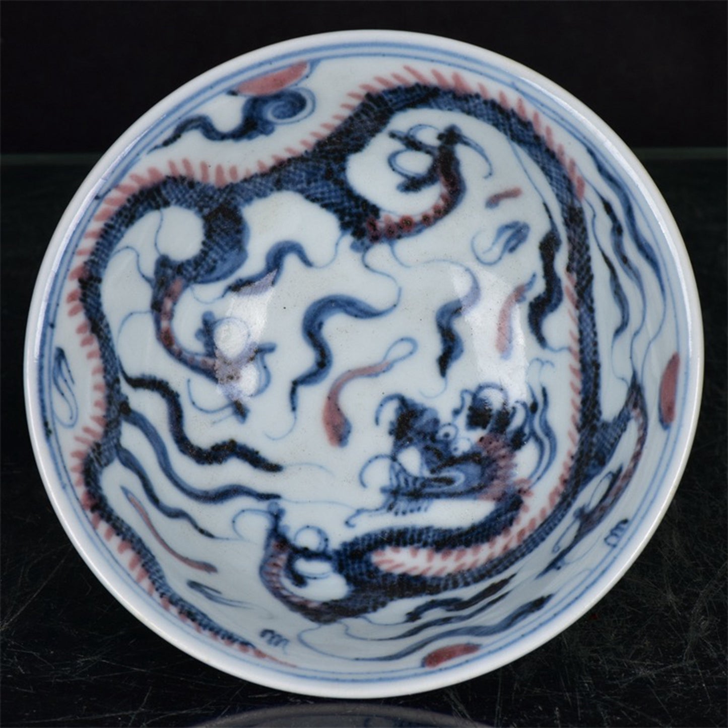 Chinese antique blue and white glazed red dragon patterned high legged bowl