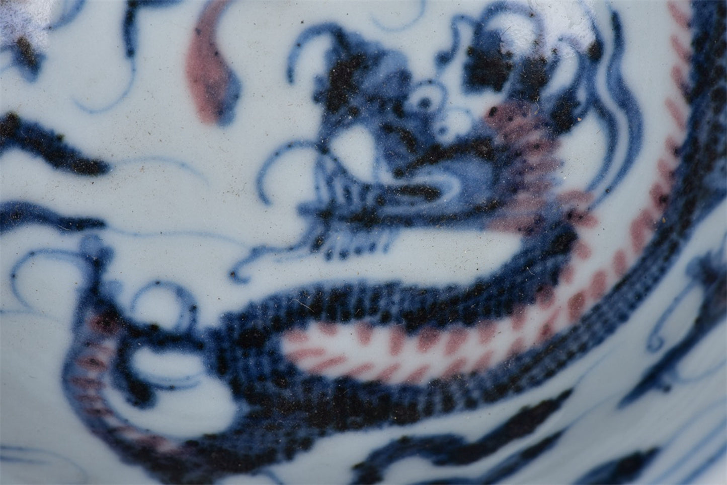 Chinese antique blue and white glazed red dragon patterned high legged bowl