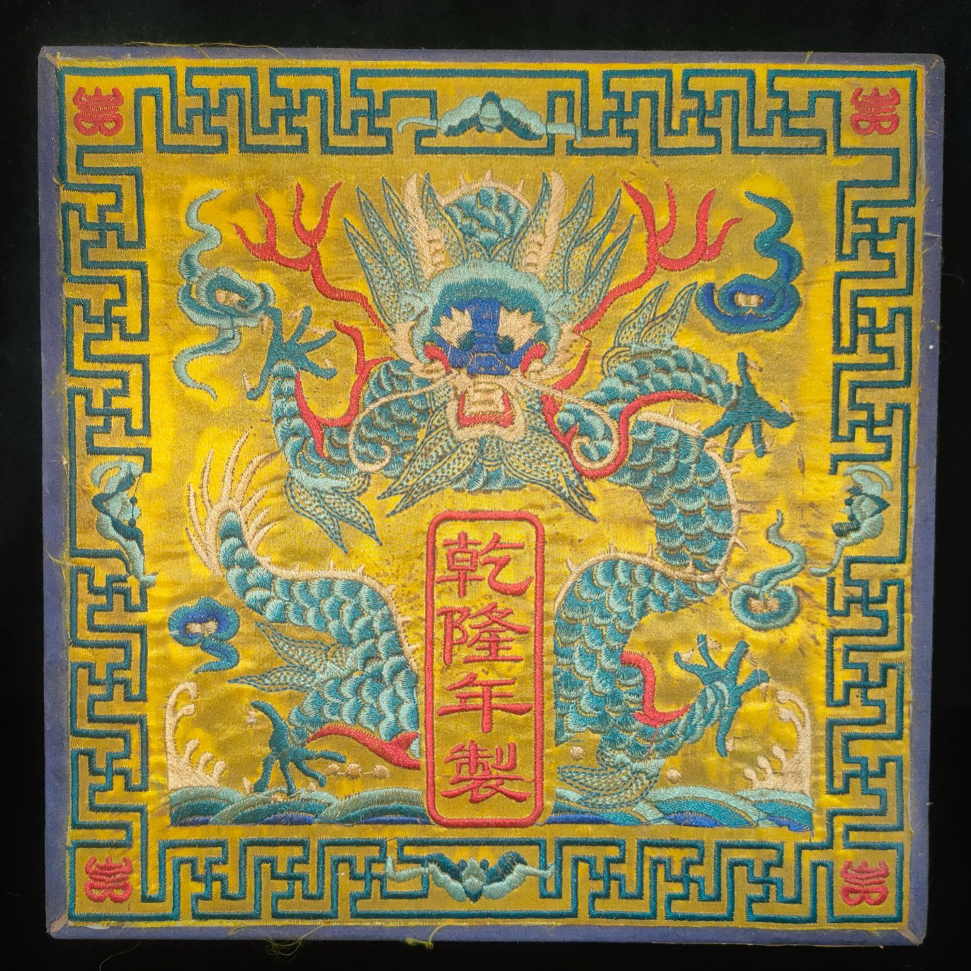 Old white tea inside the brocade box