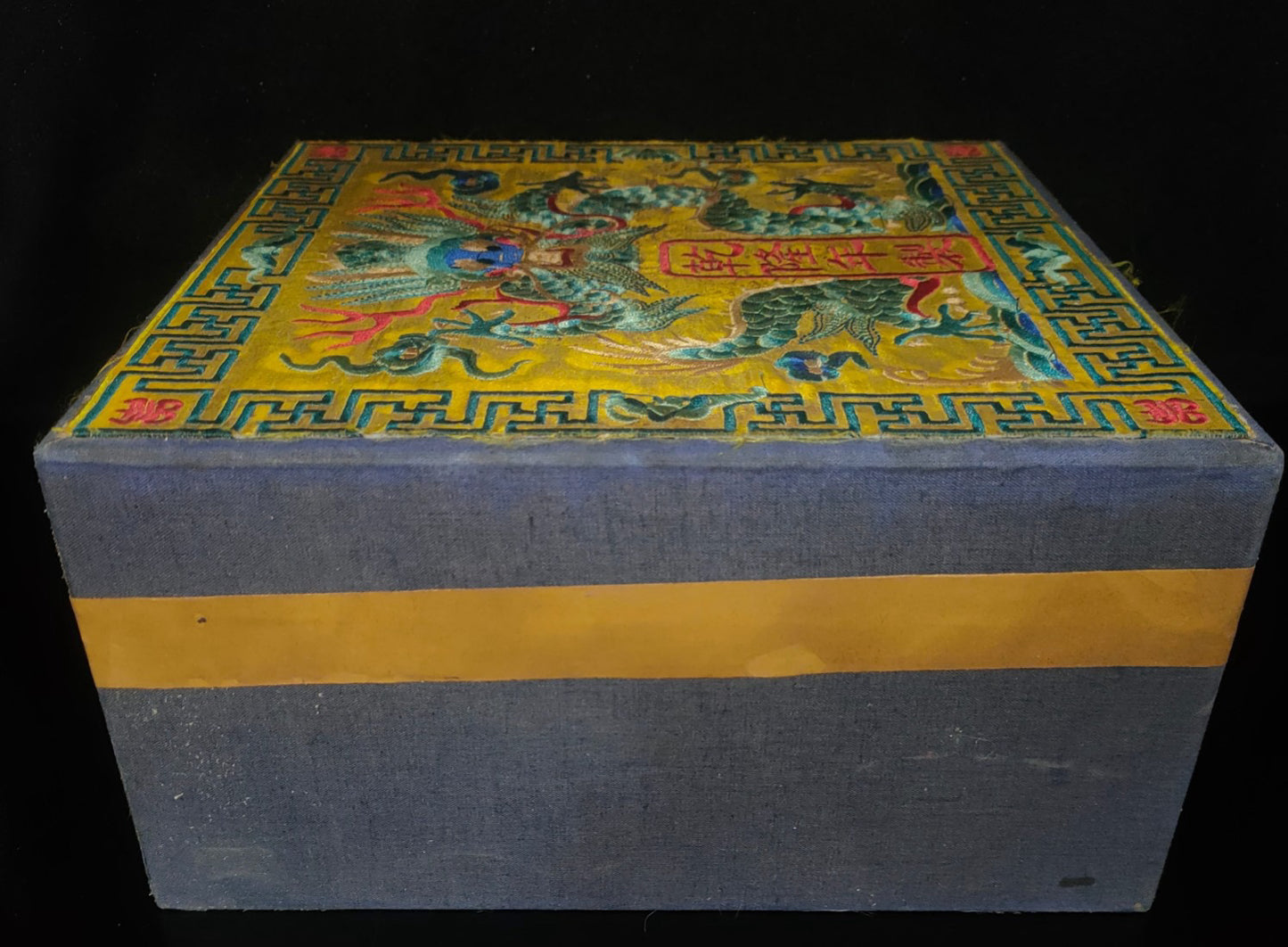 Old white tea inside the brocade box