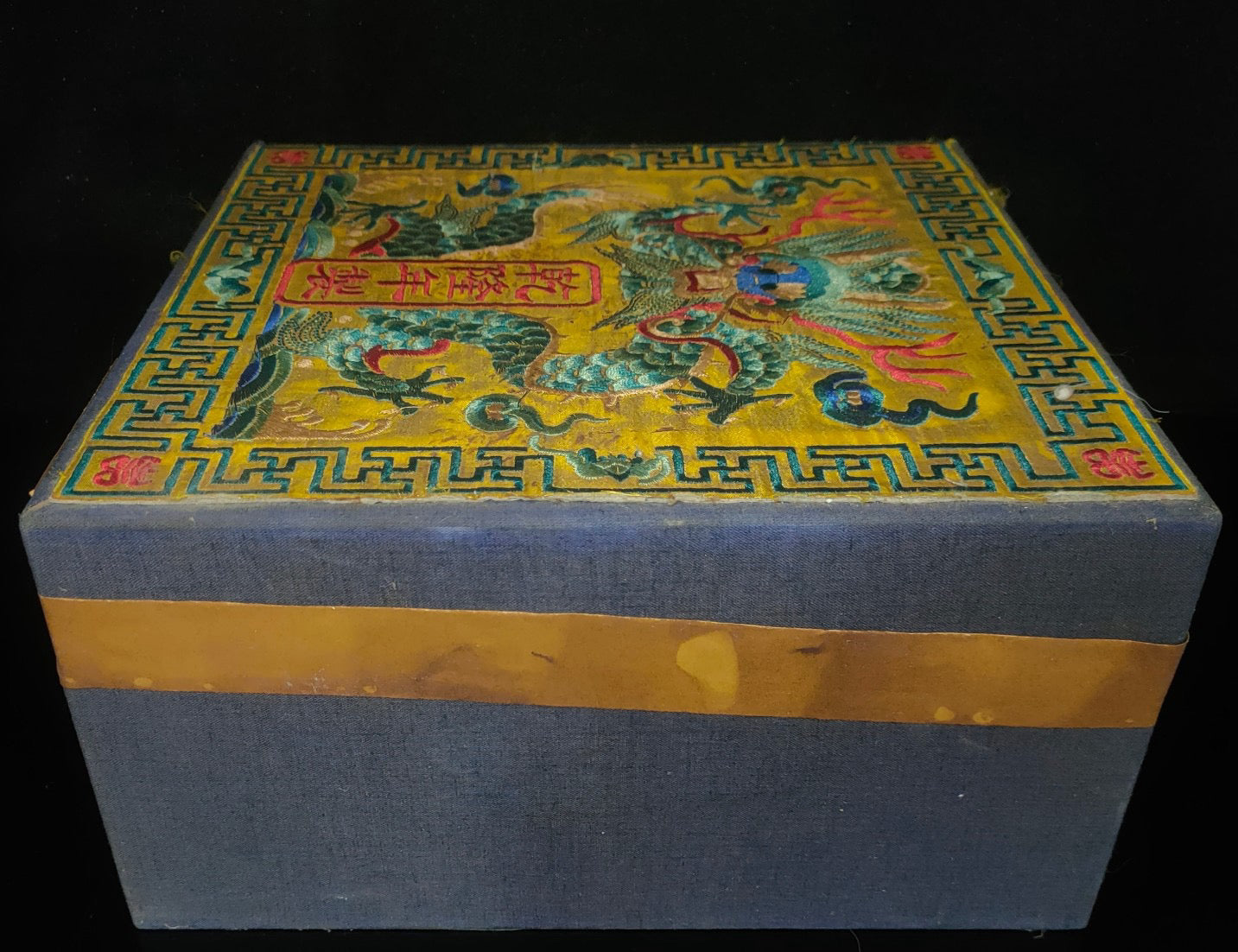 Old white tea inside the brocade box