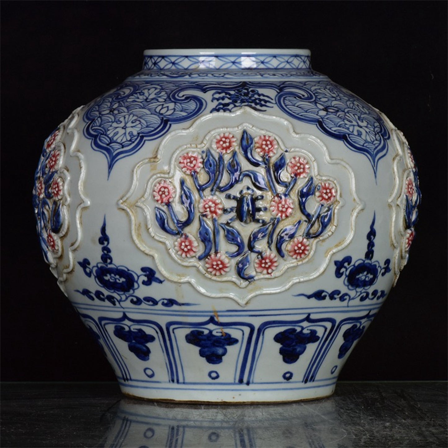 Chinese antique blue and white glazed red flower jar