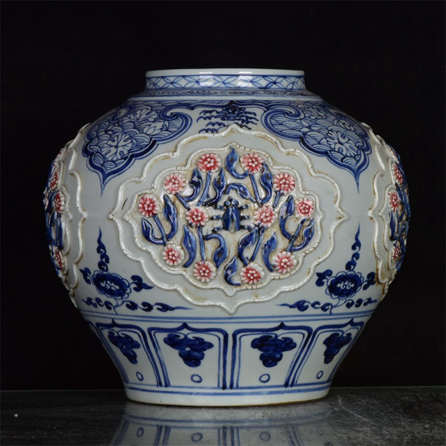 Chinese antique blue and white glazed red flower jar