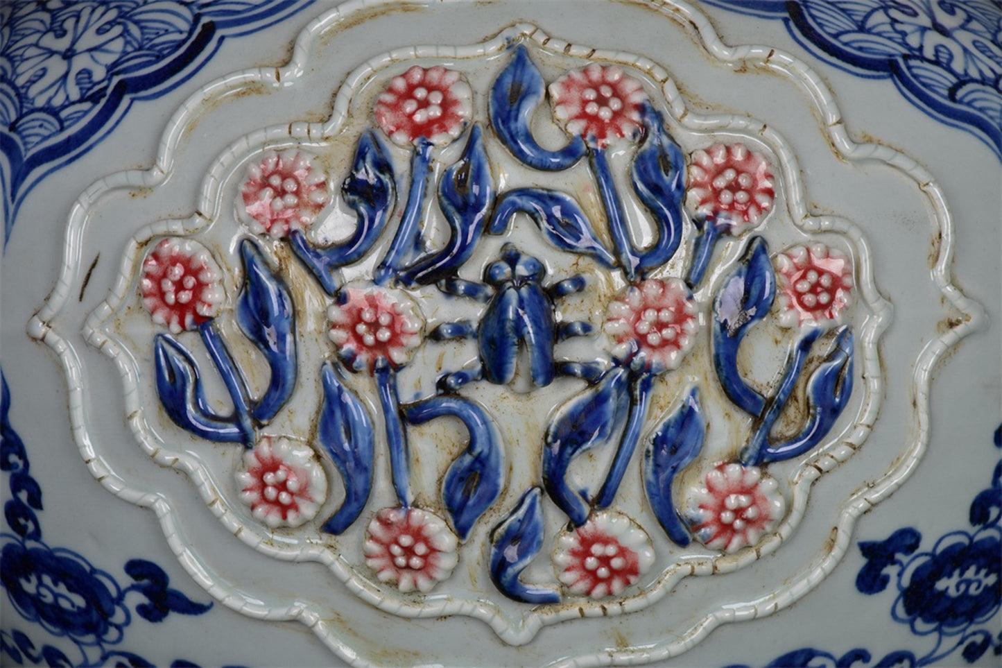 Chinese antique blue and white glazed red flower jar