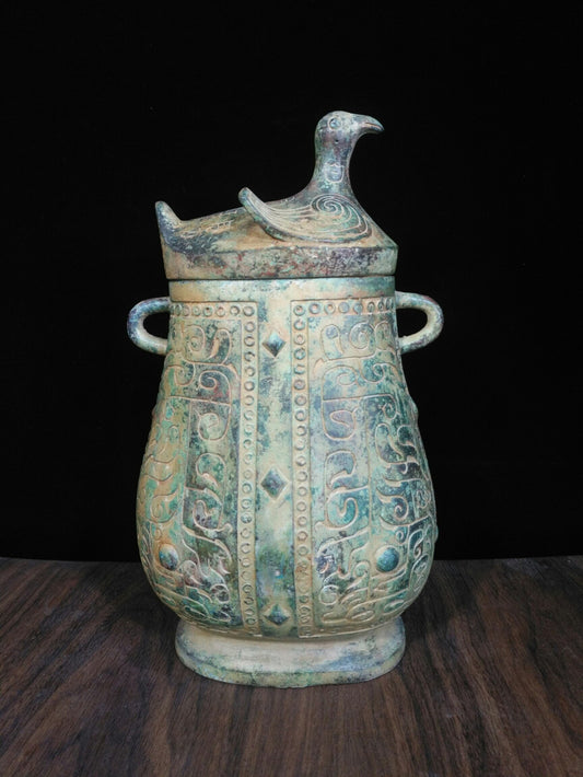 Chinese antique bronze teapot with deformed bird cover and animal pattern