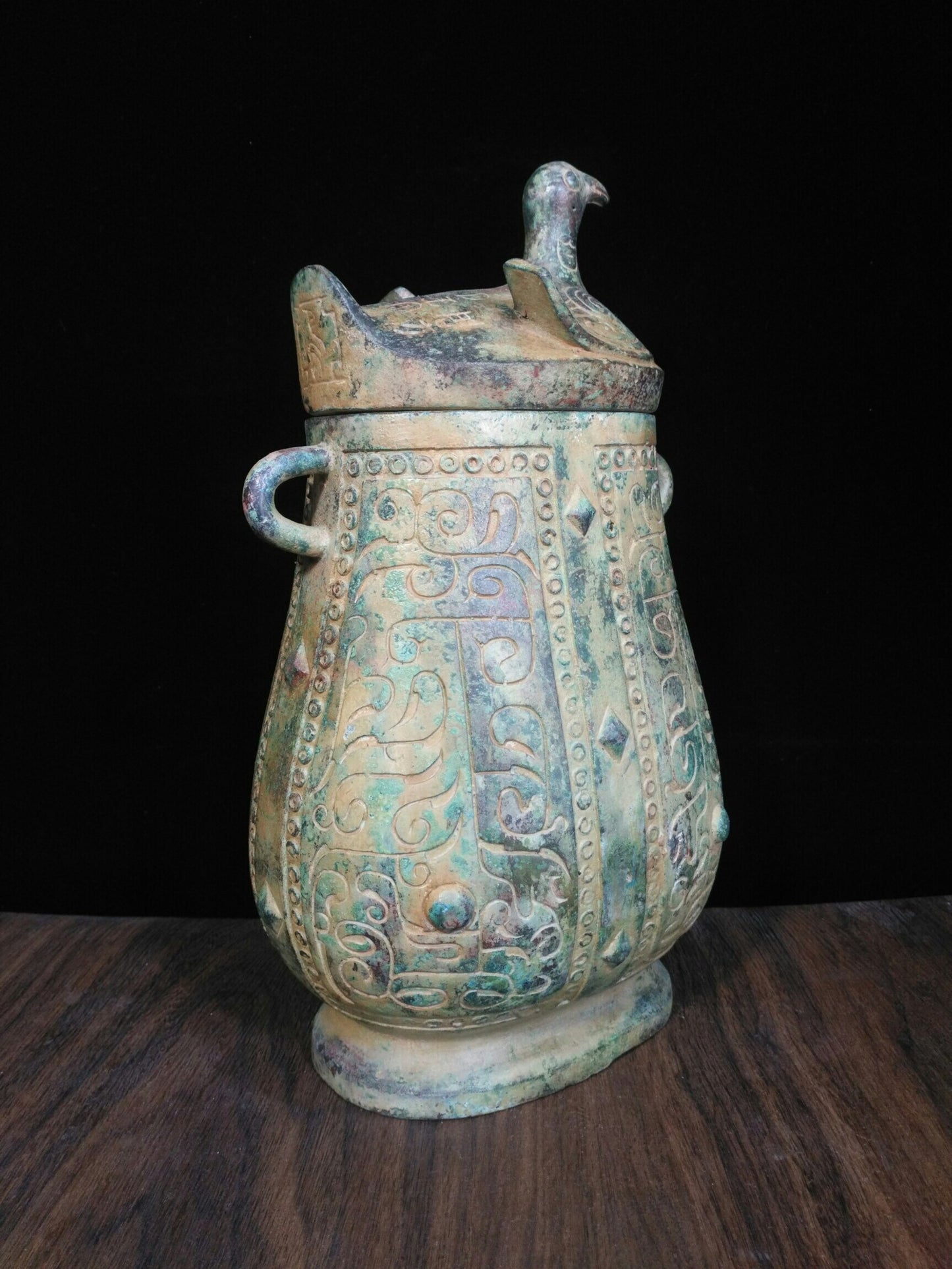 Chinese antique bronze teapot with deformed bird cover and animal pattern