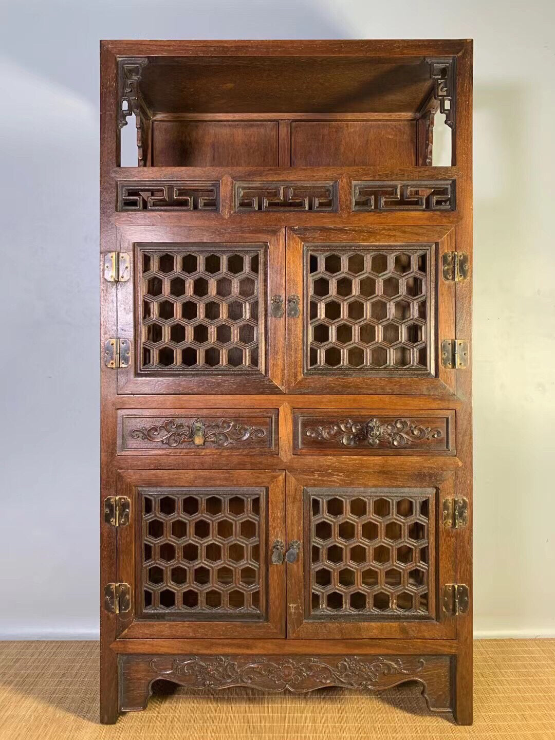 Chinese antique pear wood hollow tea cabinet