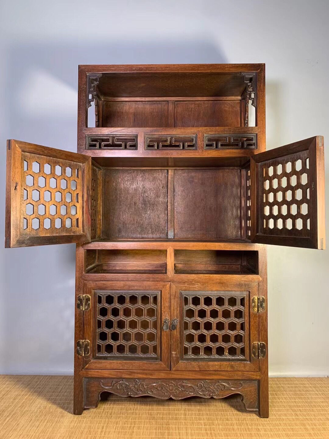 Chinese antique pear wood hollow tea cabinet
