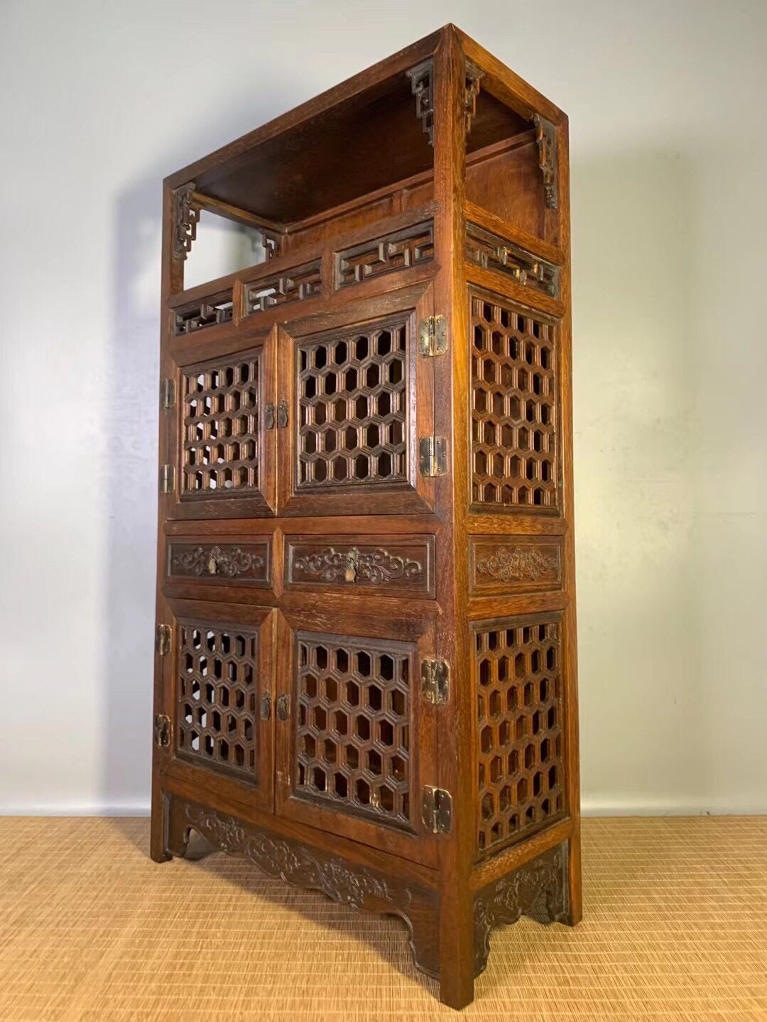 Chinese antique pear wood hollow tea cabinet
