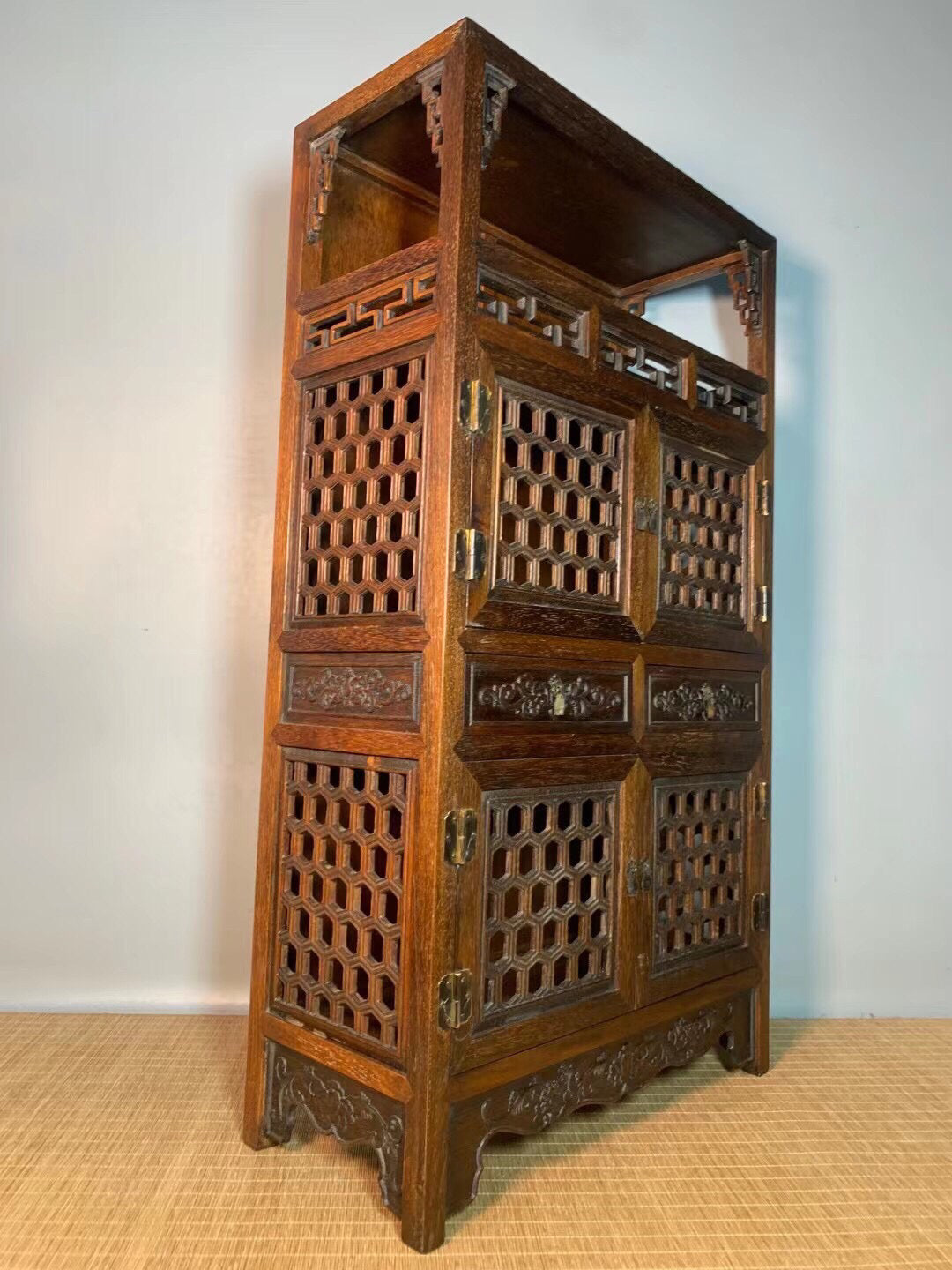 Chinese antique pear wood hollow tea cabinet