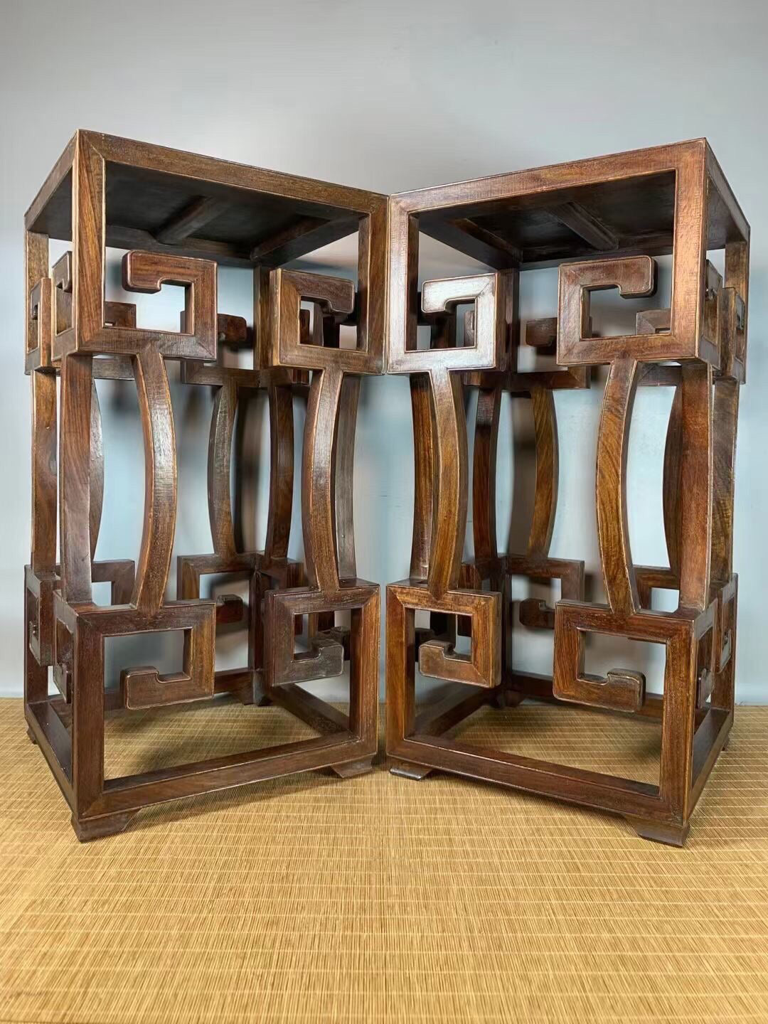 A pair of antique Chinese pear wood flower racks