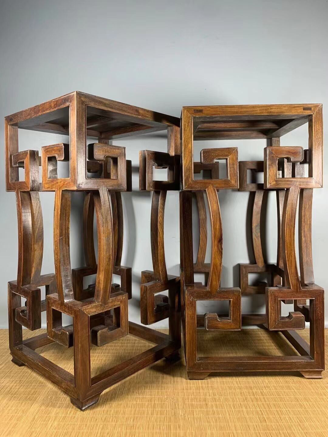 A pair of antique Chinese pear wood flower racks