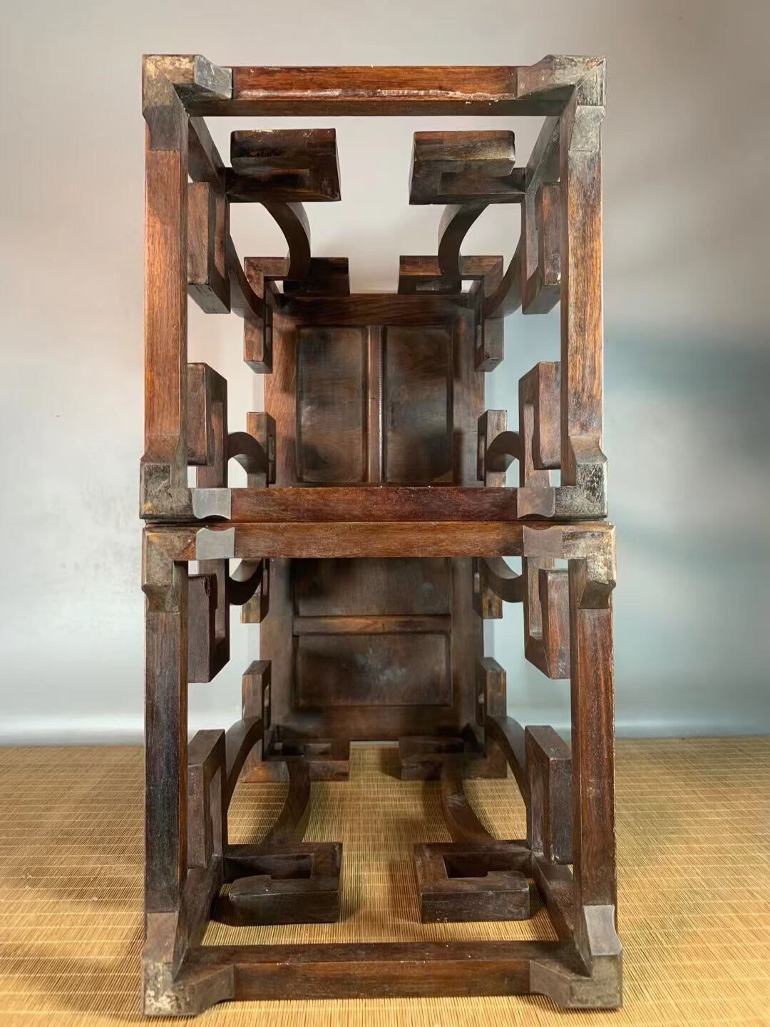 A pair of antique Chinese pear wood flower racks