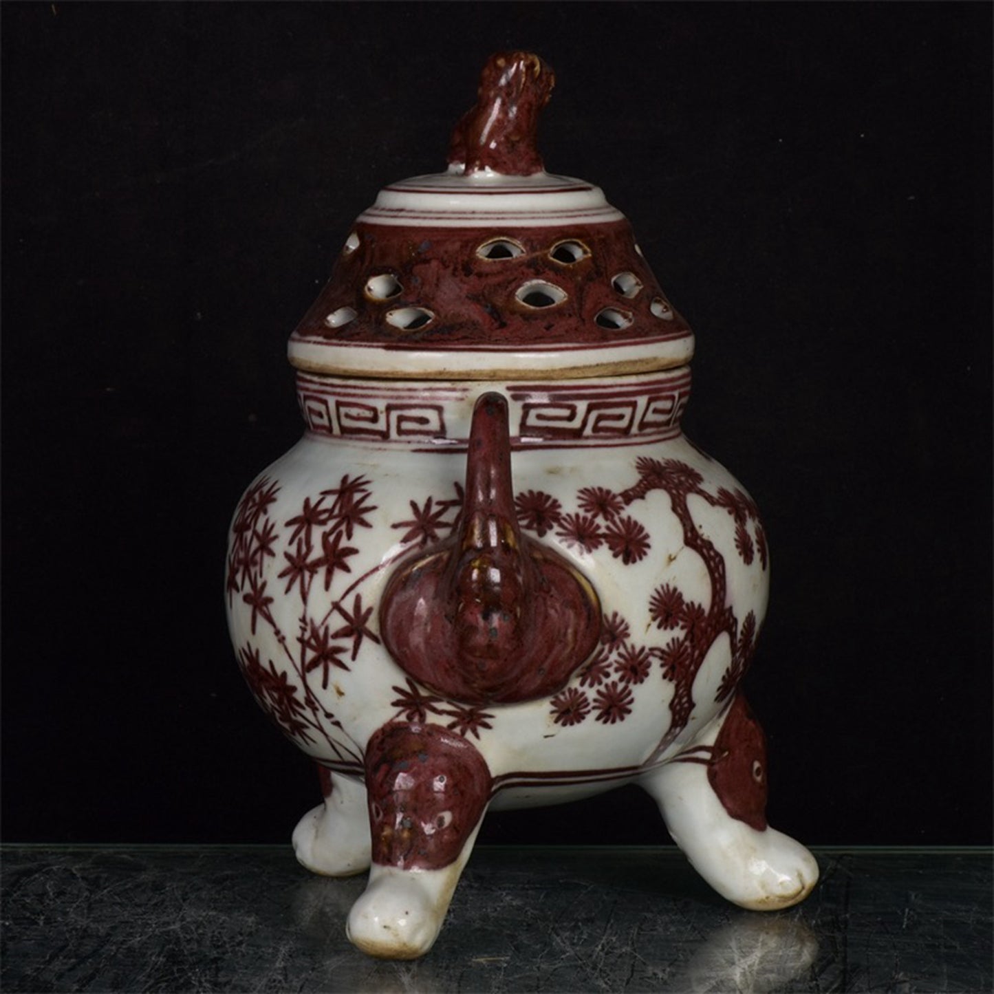 Chinese antique patterned three legged double ear incense burner