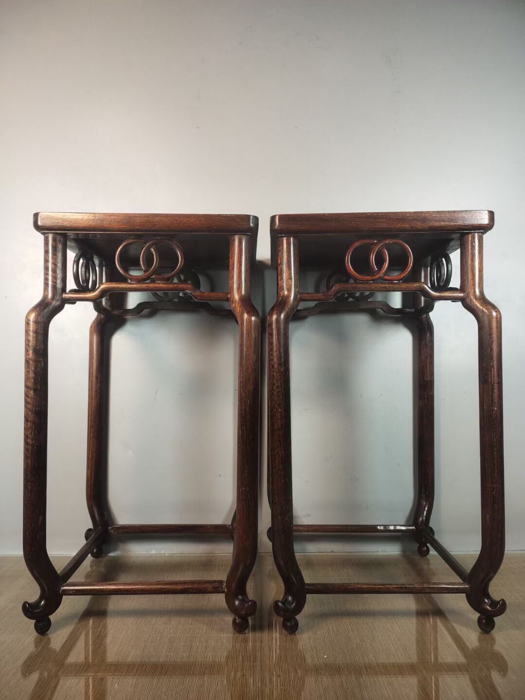 A pair of antique Chinese pear wood flower racks