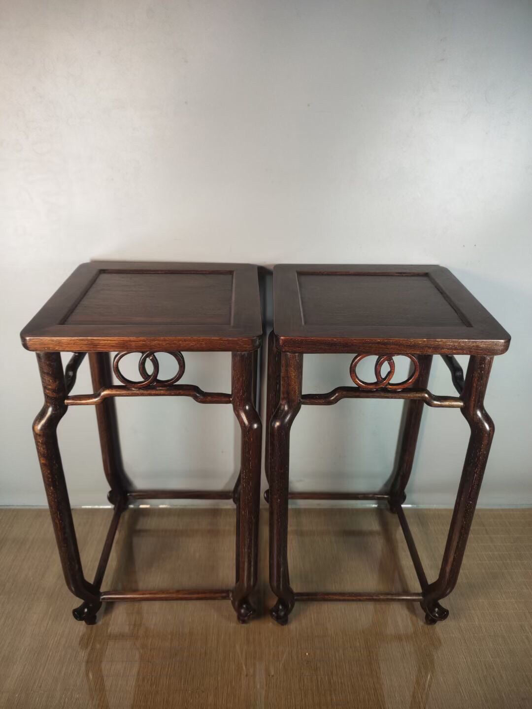 A pair of antique Chinese pear wood flower racks