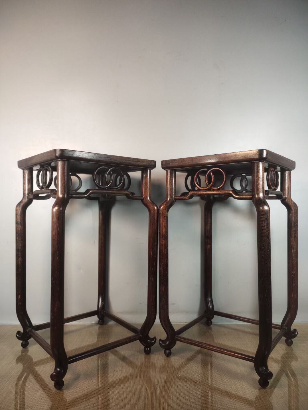 A pair of antique Chinese pear wood flower racks