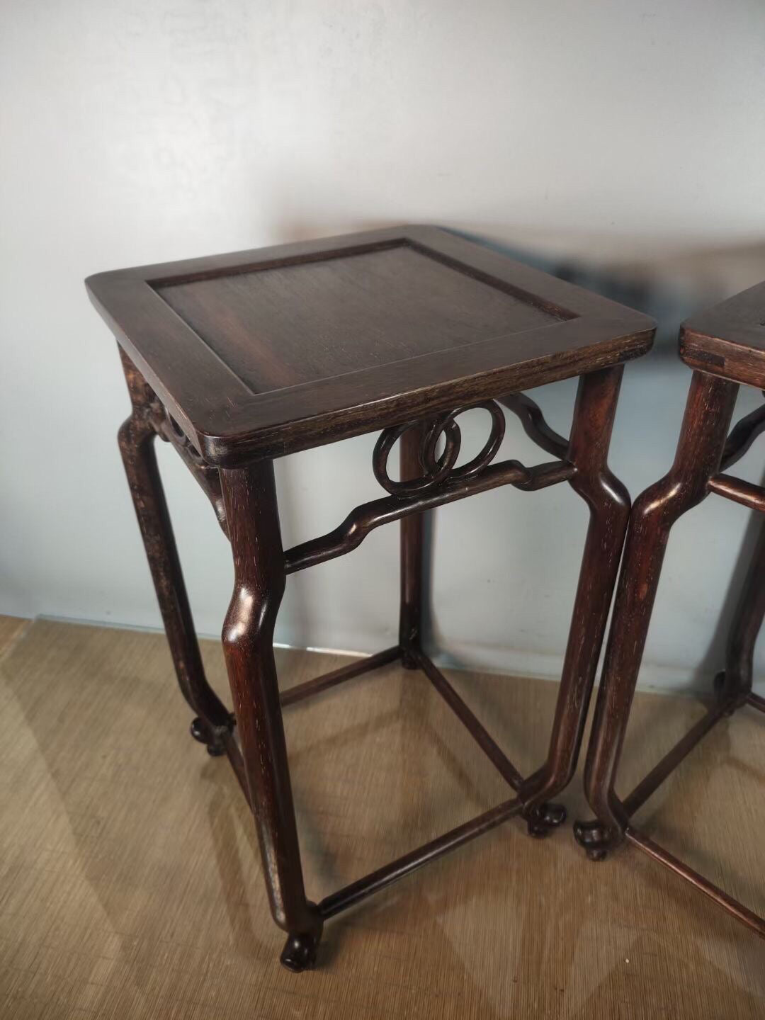 A pair of antique Chinese pear wood flower racks