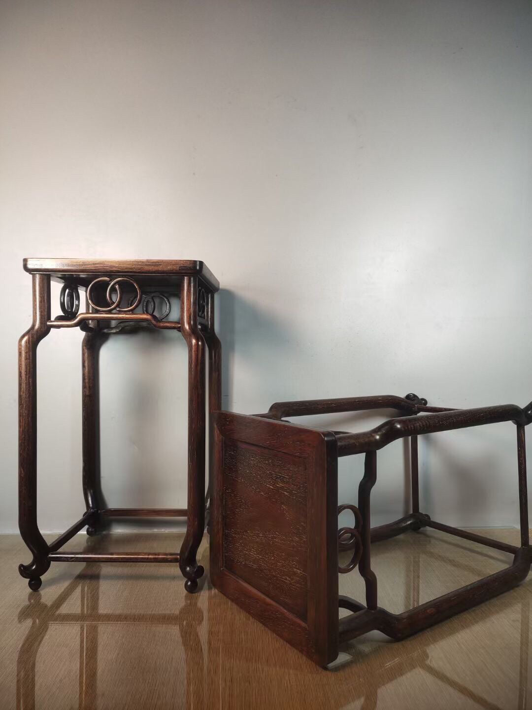 A pair of antique Chinese pear wood flower racks