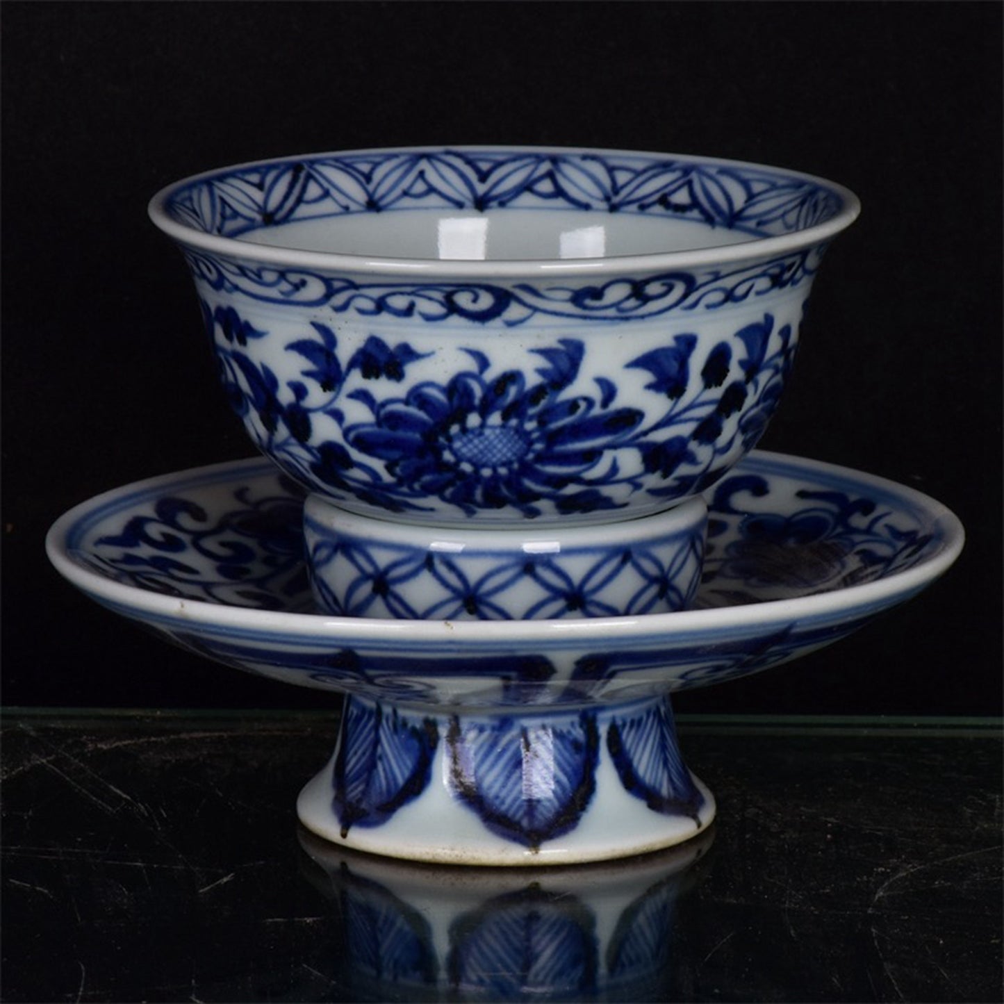 Chinese antique blue and white tea cups with tangled branches and floral patterns