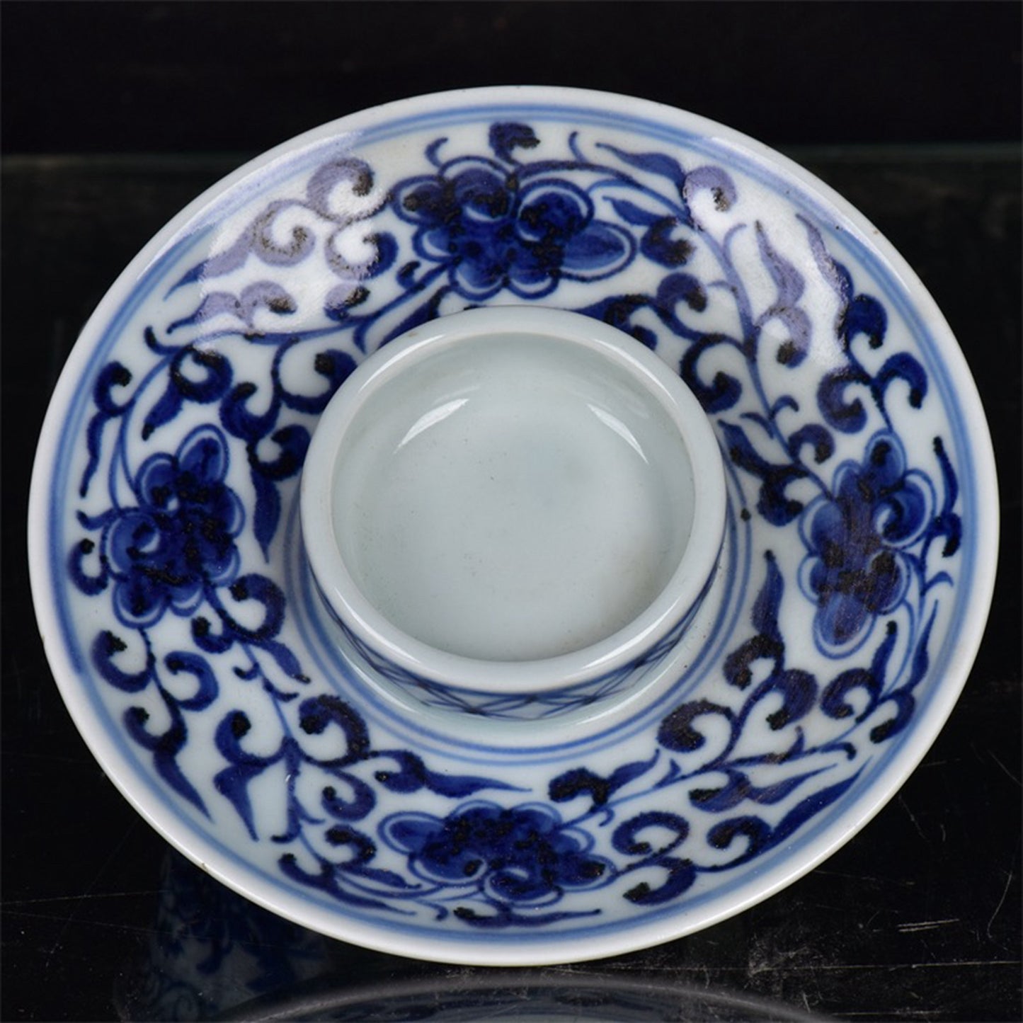 Chinese antique blue and white tea cups with tangled branches and floral patterns