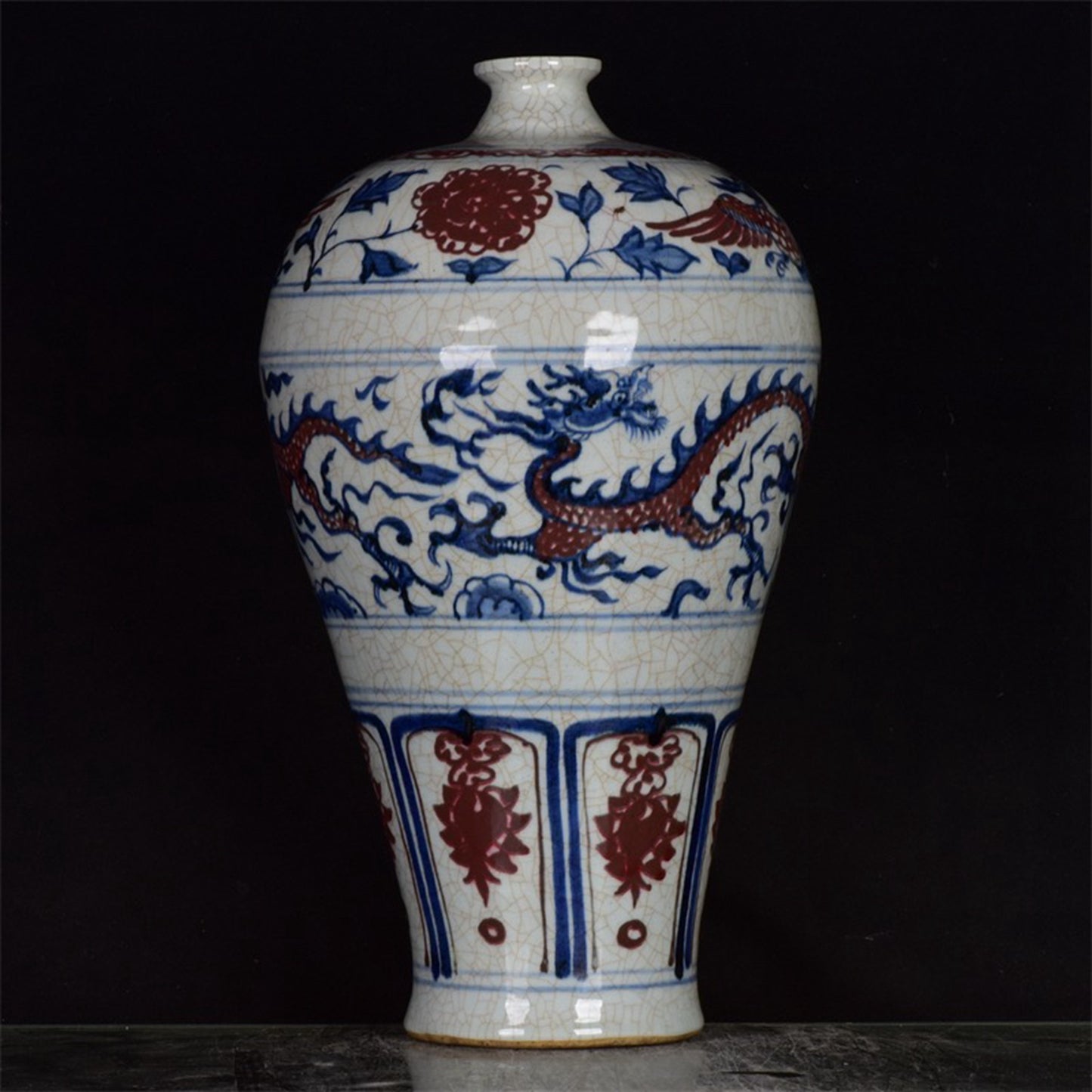 Chinese antique blue and white glazed red dragon patterned open leaf plum vase