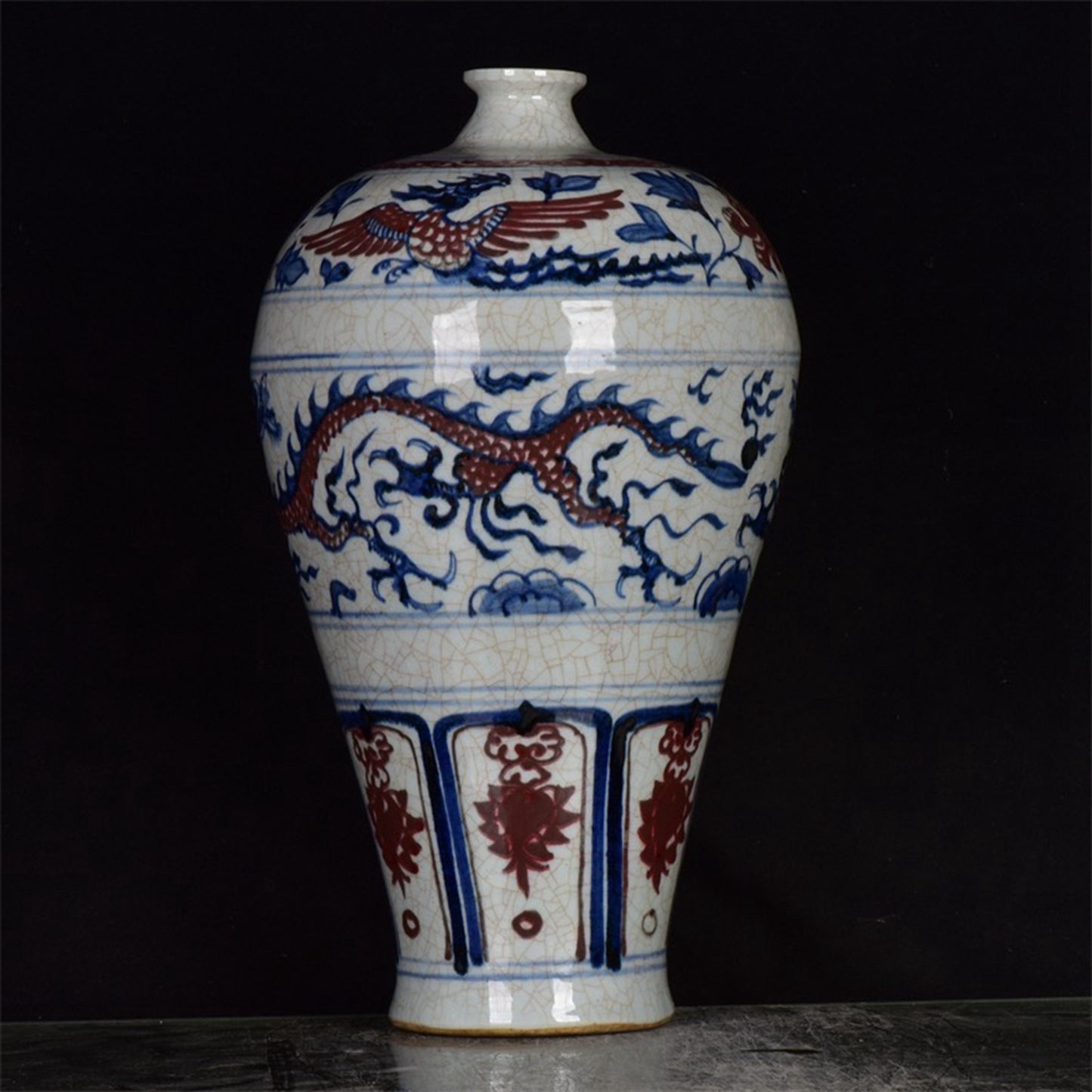Chinese antique blue and white glazed red dragon patterned open leaf plum vase