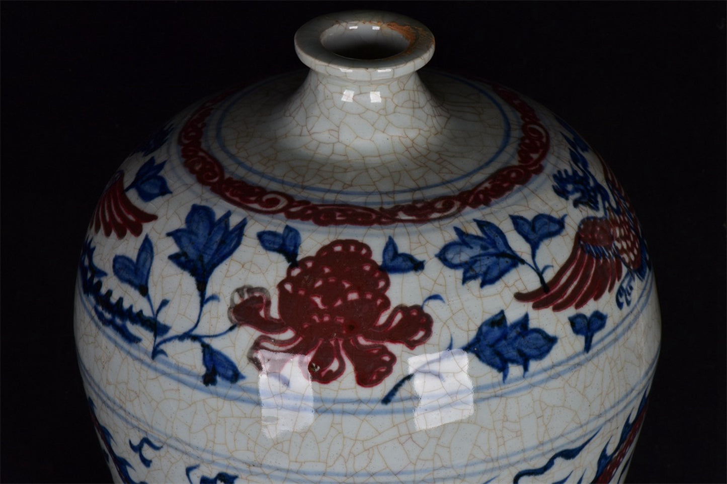 Chinese antique blue and white glazed red dragon patterned open leaf plum vase