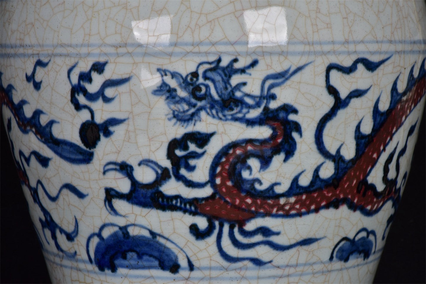 Chinese antique blue and white glazed red dragon patterned open leaf plum vase