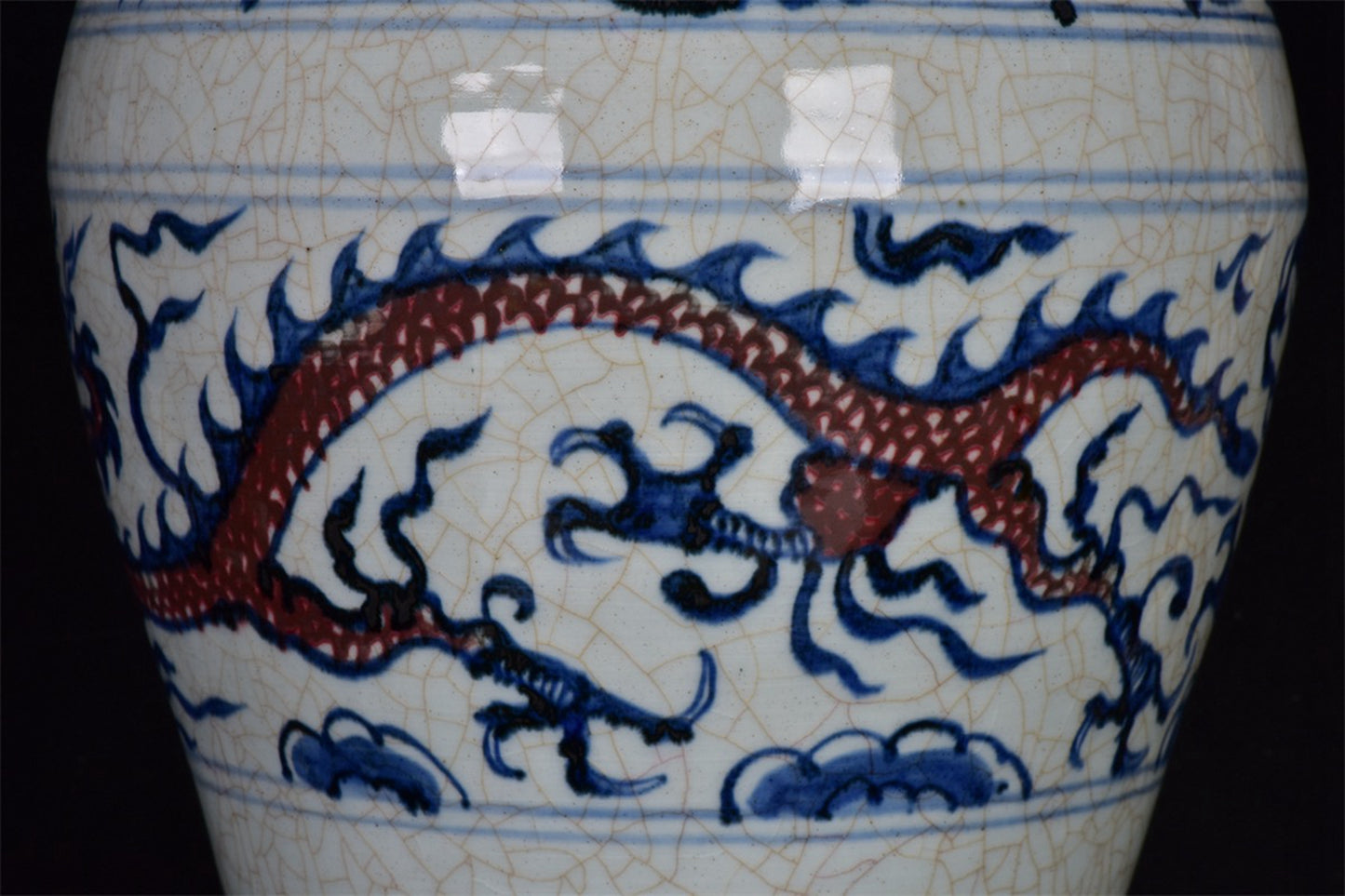 Chinese antique blue and white glazed red dragon patterned open leaf plum vase