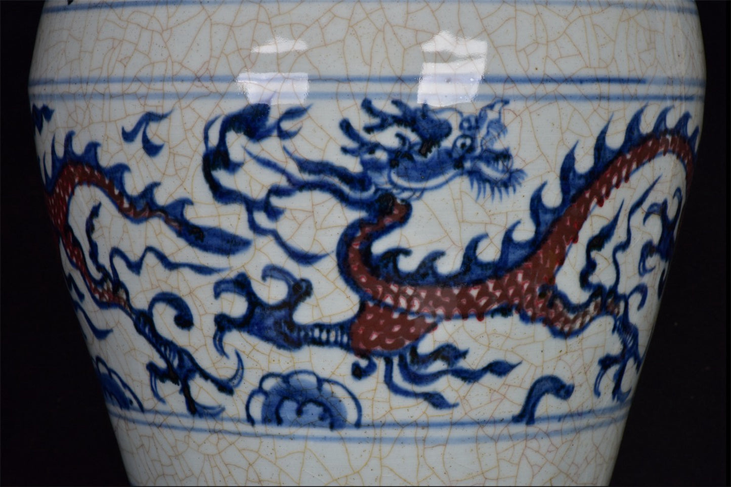 Chinese antique blue and white glazed red dragon patterned open leaf plum vase