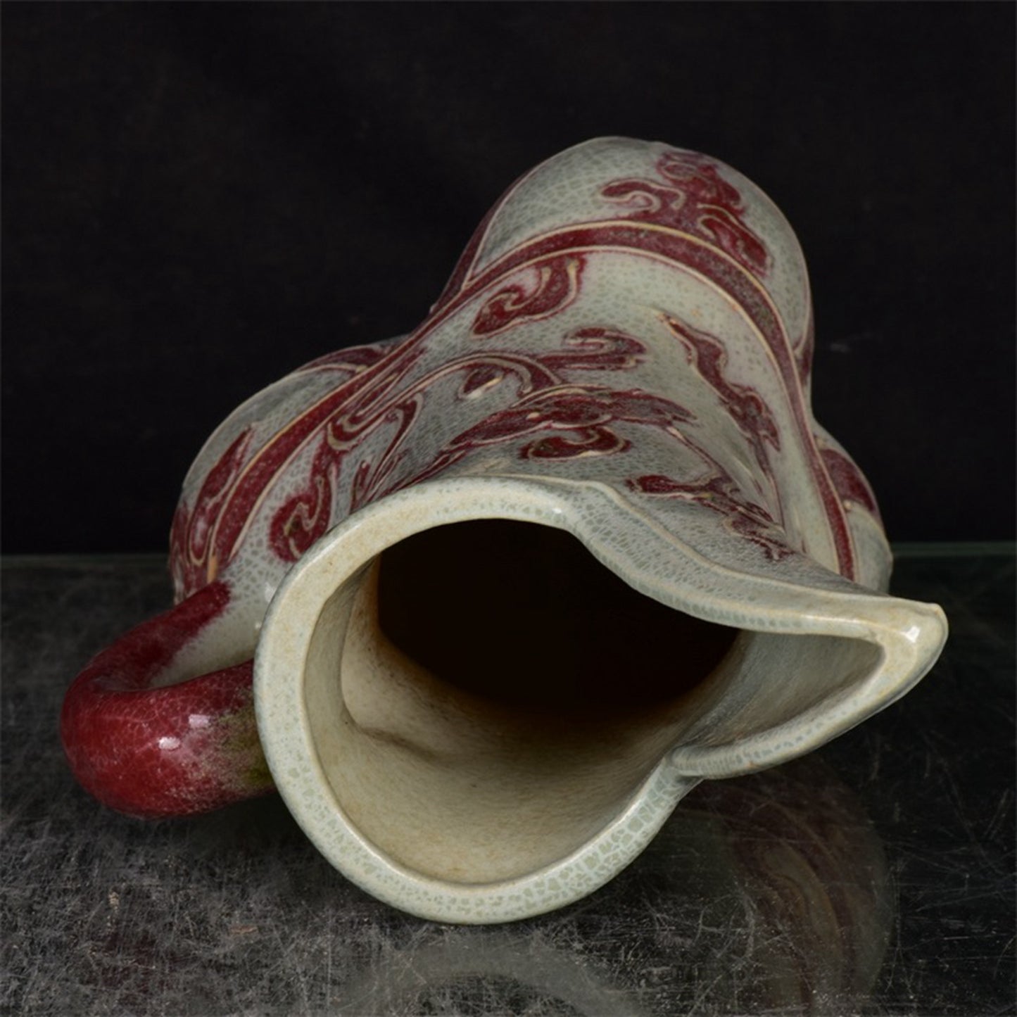Chinese antique glazed red flower patterned three legged cup