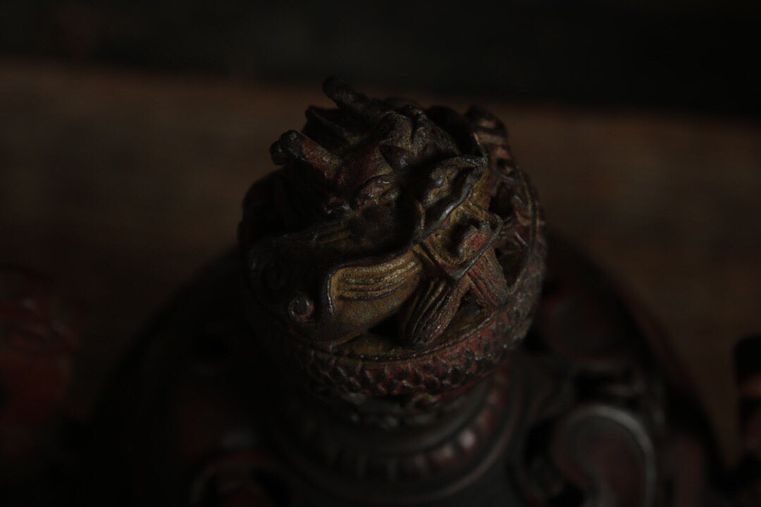 A Chinese antique pure copper incense burner with three legs and two dragons