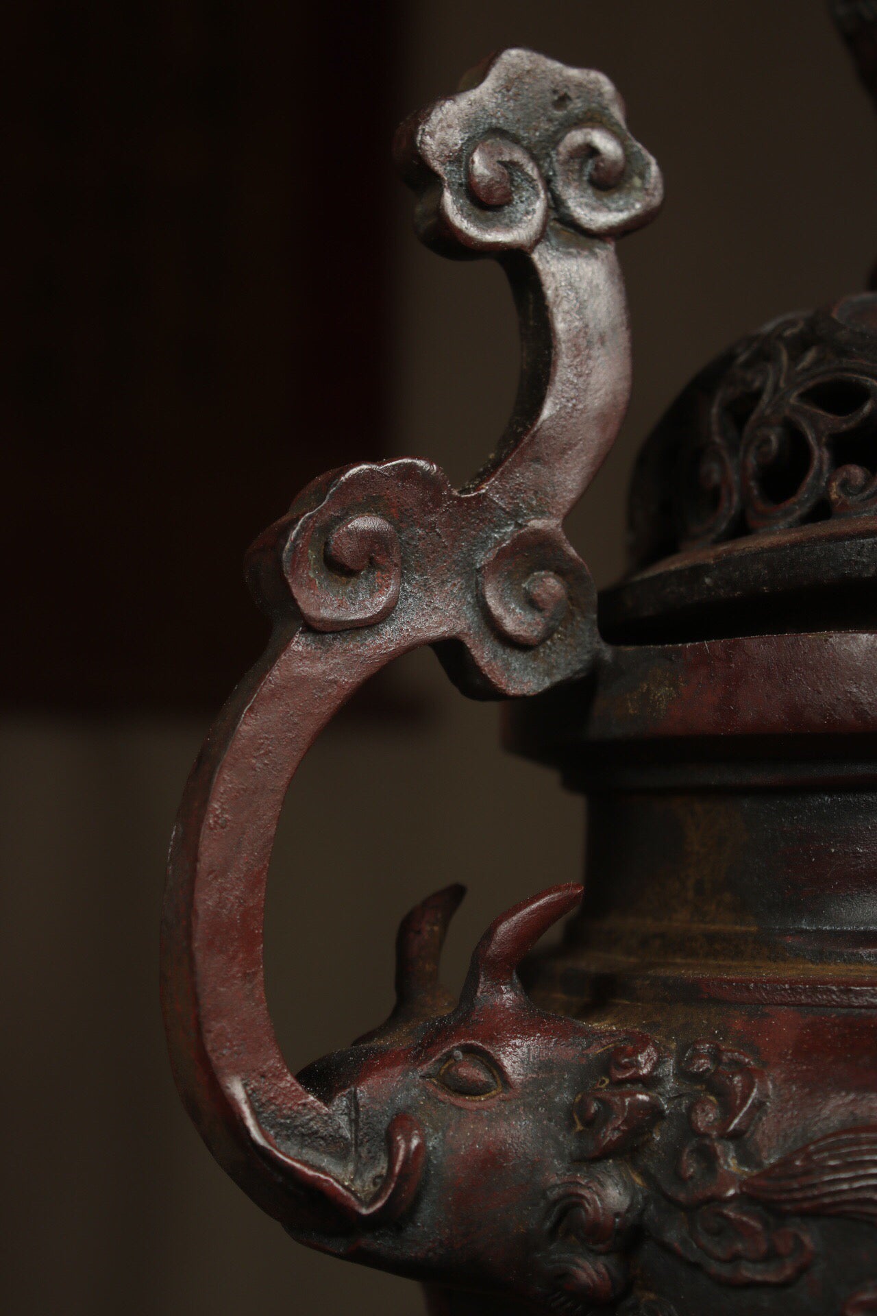 A Chinese antique pure copper incense burner with three legs and two dragons