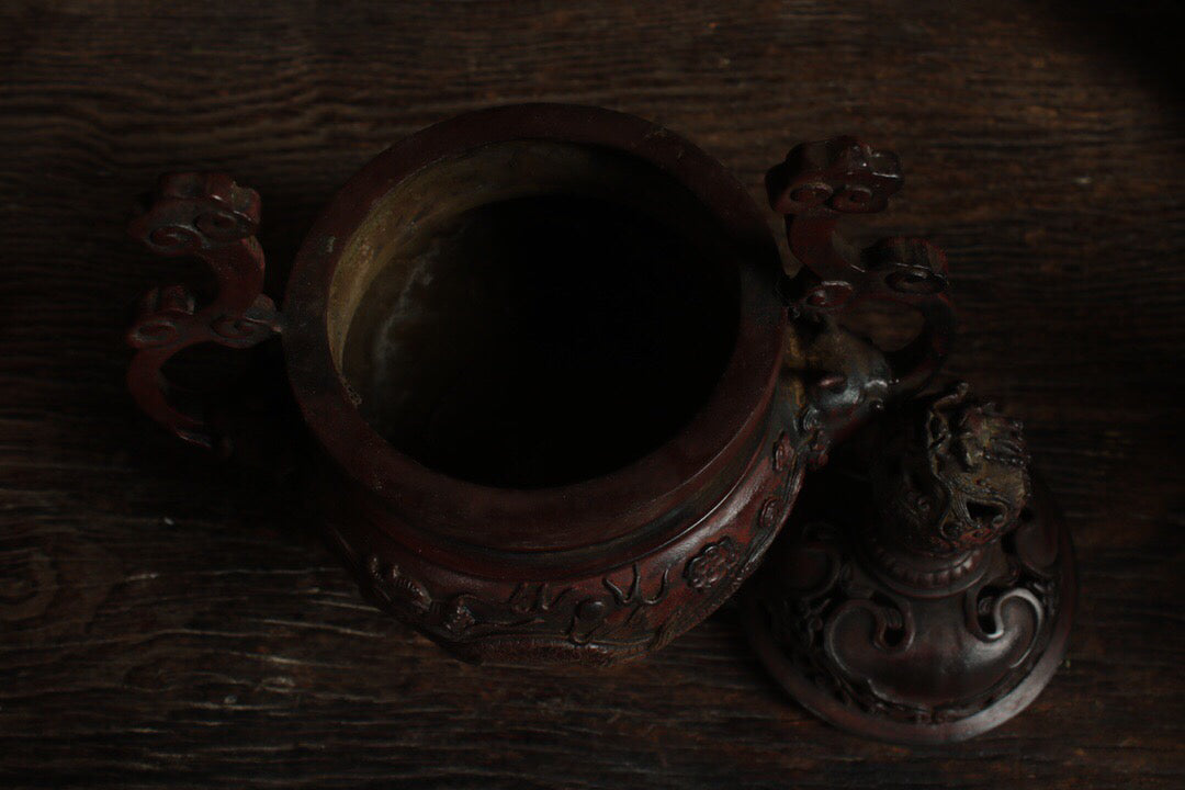 A Chinese antique pure copper incense burner with three legs and two dragons