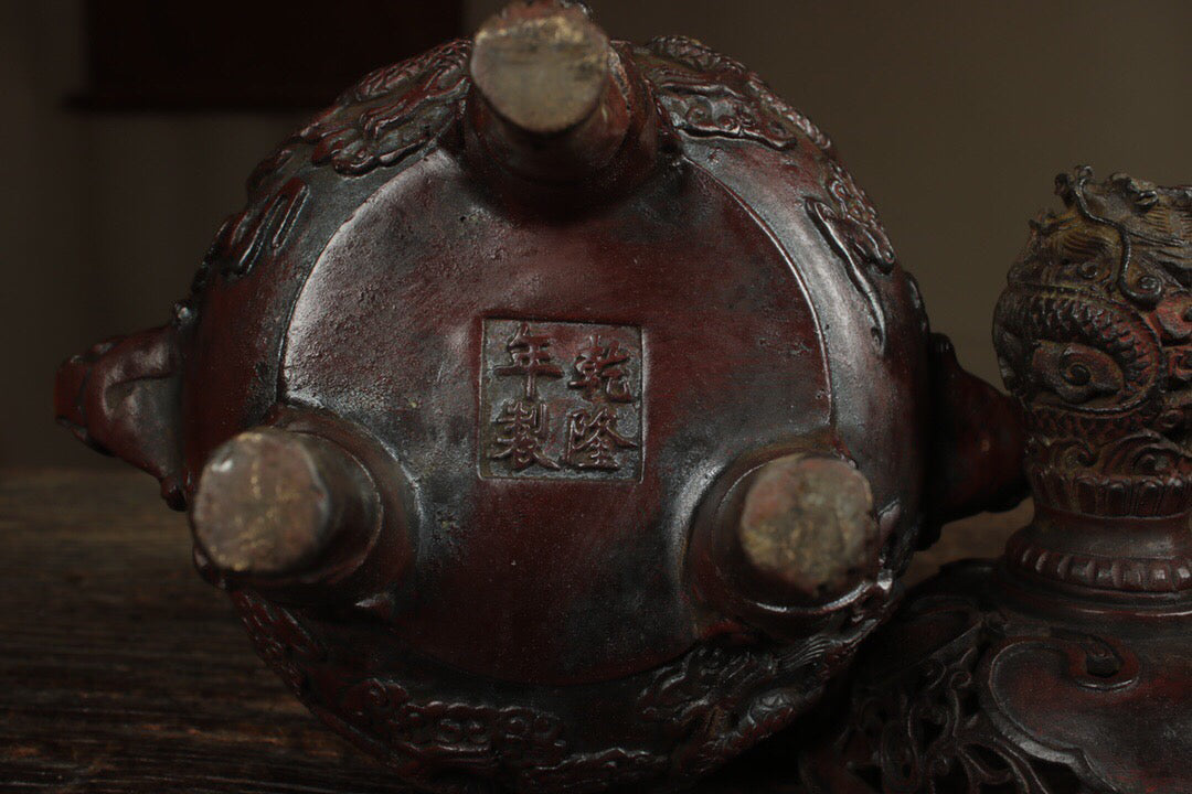 A Chinese antique pure copper incense burner with three legs and two dragons